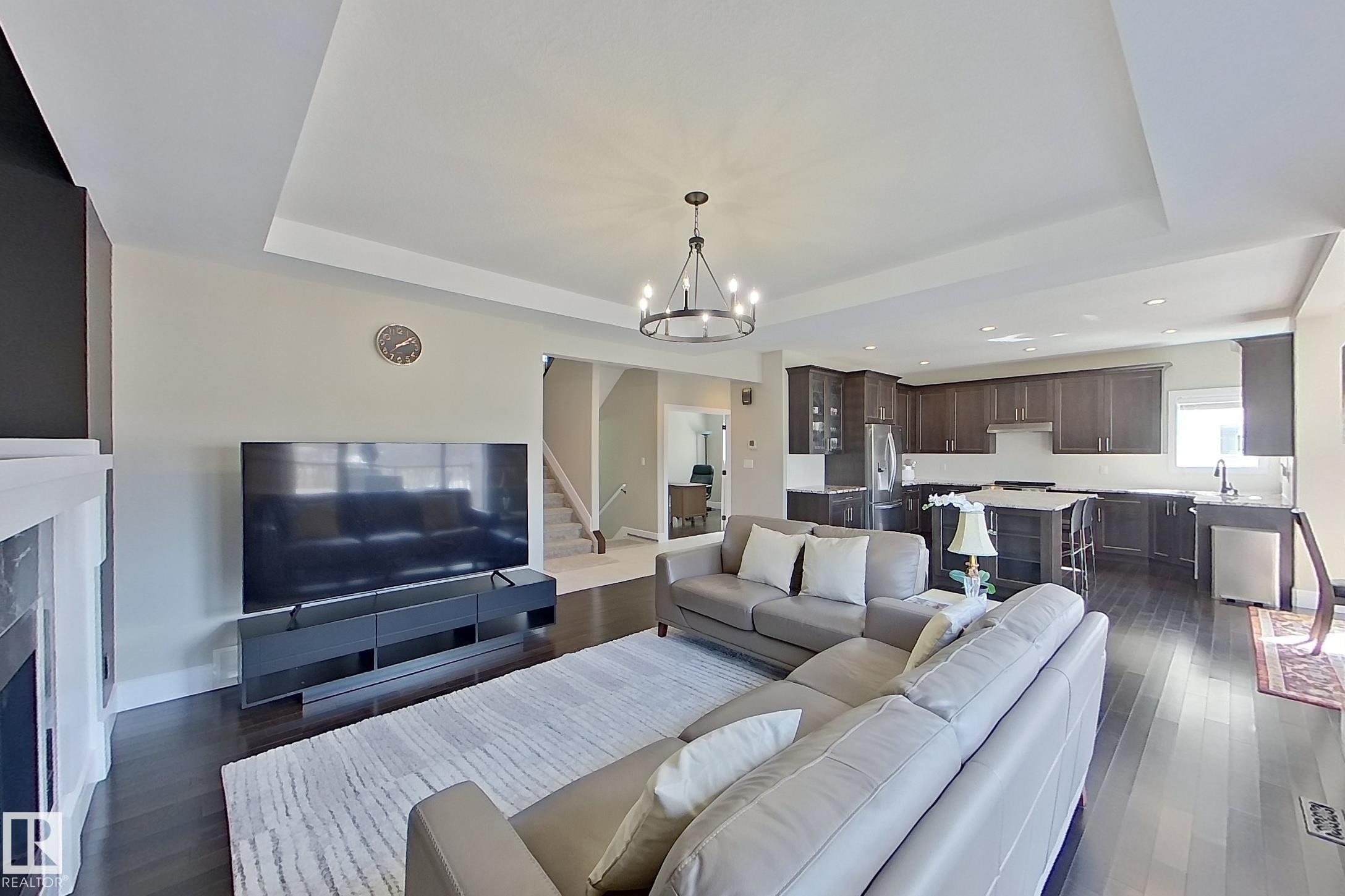 5512 64 Street, Beaumont, AB - Indoor Photo Showing Living Room With Fireplace