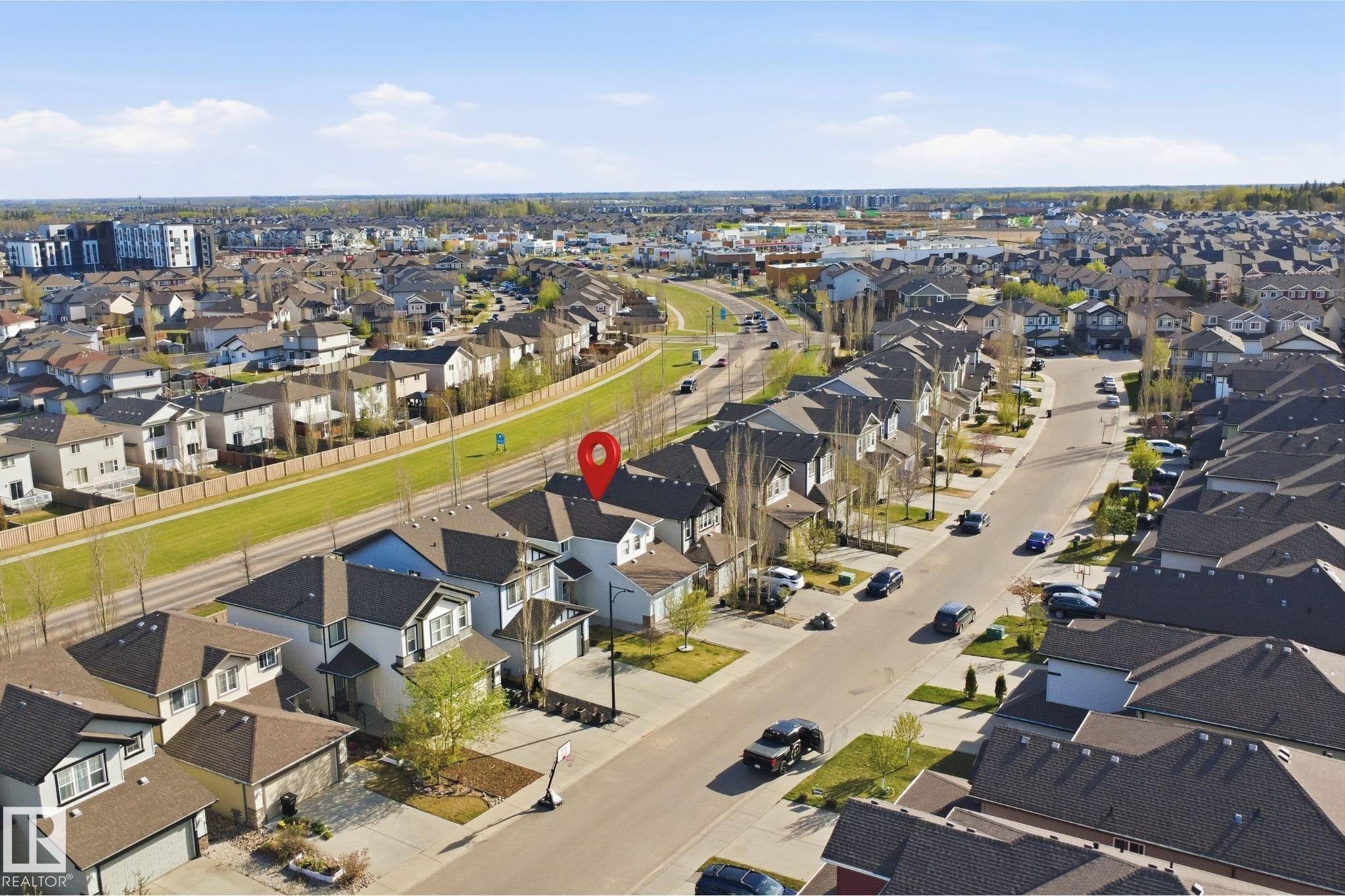 Residential property situated within a developed neighborhood, featuring a dark shingle roof and a light-colored exterior - 1453 Hays Way Nw, Edmonton, AB - Outdoor With View