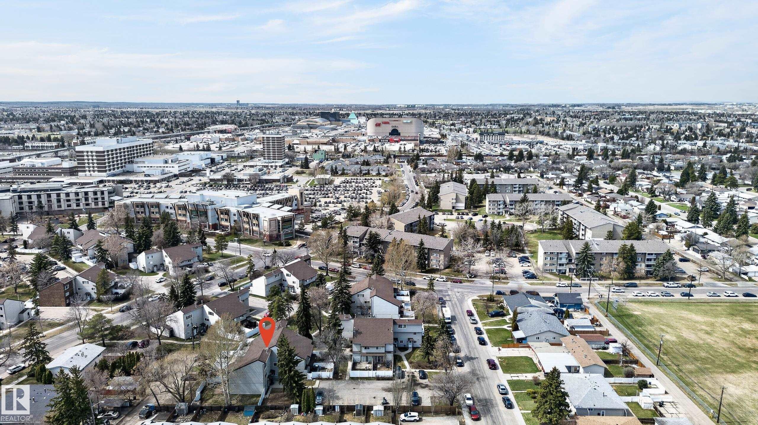 Aerial perspective showcasing the property within a developed residential area - 26E Meadowlark Village, Edmonton, AB - Outdoor With View