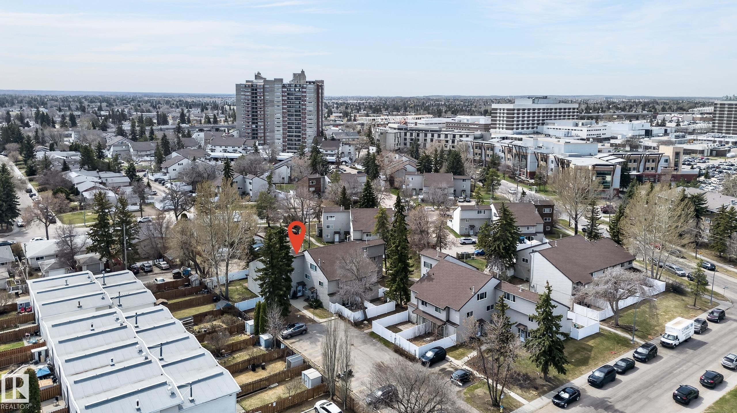 Aerial perspective of a developed residential area featuring various housing styles and mature trees - 26E Meadowlark Village, Edmonton, AB - Outdoor With View