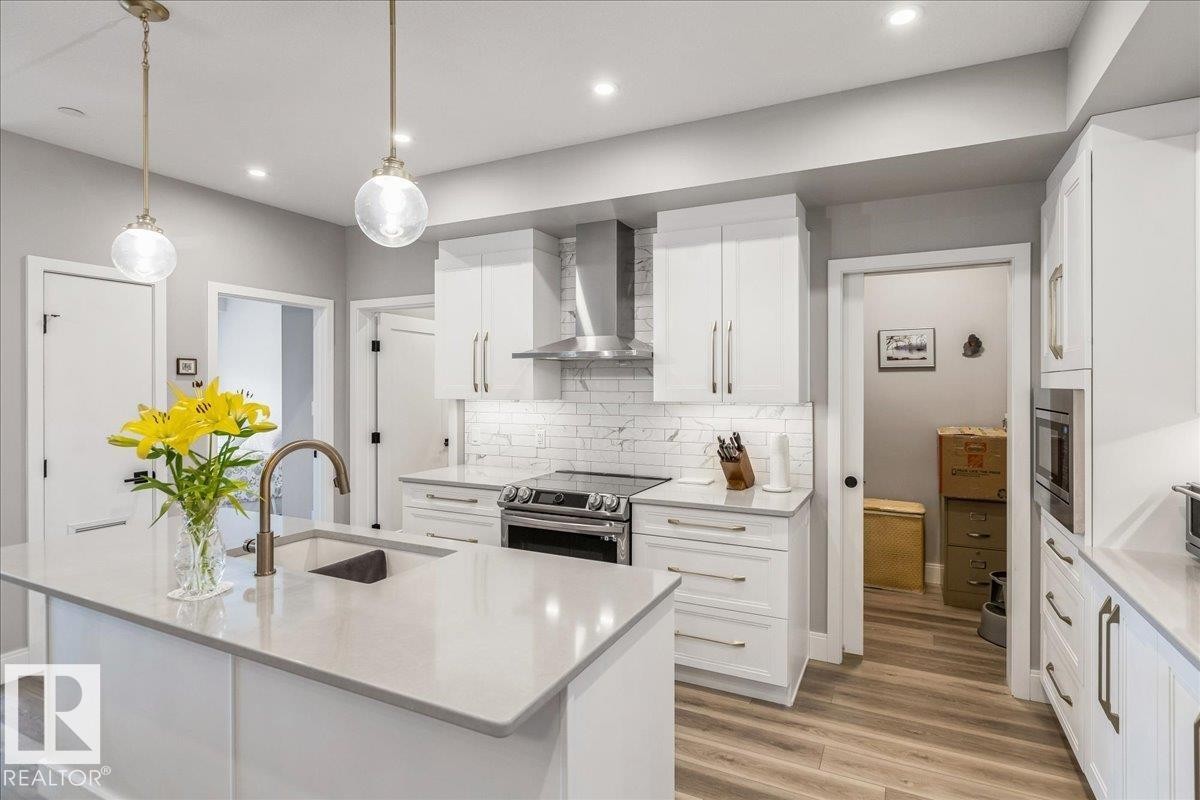 QUARTZ COUNTERS, STAINLESS STEEL APPLIANCES AND AMPLE CABINETS - 428 7463 May Common, Edmonton, AB - Indoor Photo Showing Kitchen With Upgraded Kitchen