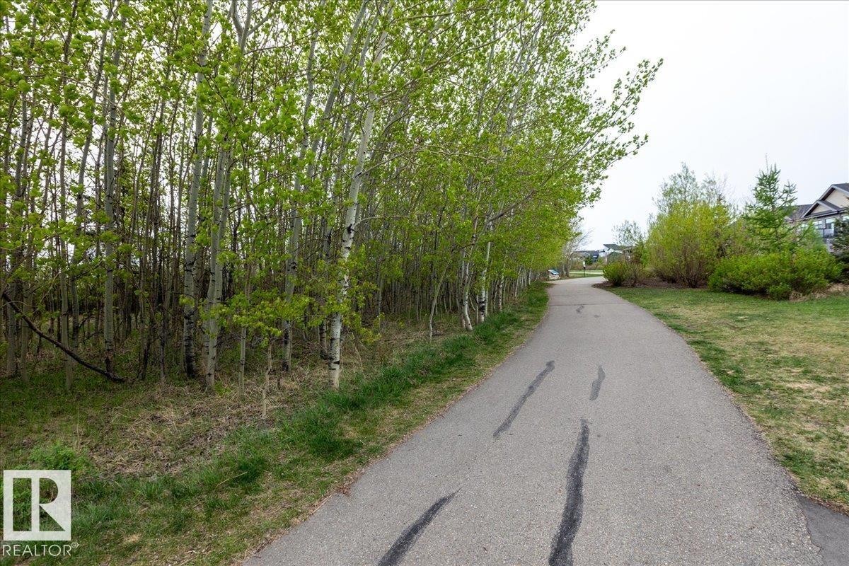 THE BUILDING IS ADJACENT TO THE WHITEMUD RAVINE / MACTAGGART SANCTUARY WITH KILOMETRES OF WALKING PATHS RIGHT OUTSIDE OF YOUR DOOR! - 428 7463 May Common, Edmonton, AB - Outdoor