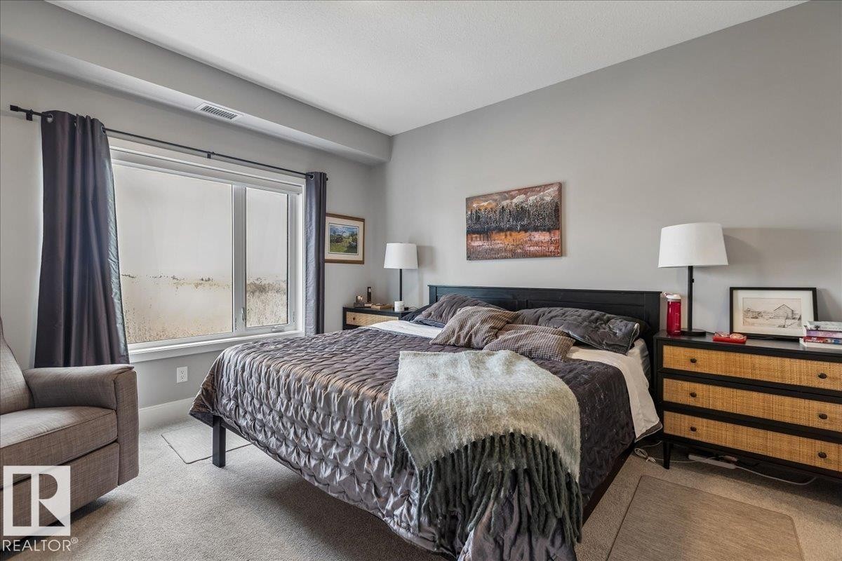 LARGE PRIMARY BEDROOM WITH SPACE FOR A KING BED - 405 7463 May Common, Edmonton, AB - Indoor Photo Showing Bedroom