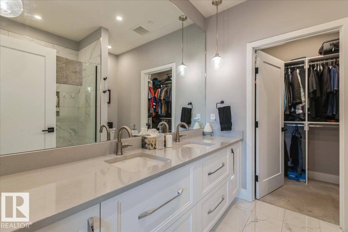 4 PC ENSUITE WITH QUARTZ COUNTERS, DUAL SINKS AND LARGE WALK IN SHOWER - 405 7463 May Common, Edmonton, AB - Indoor Photo Showing Bathroom