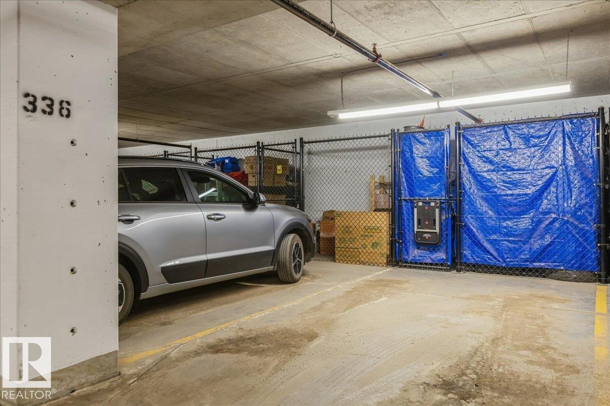 HEATED INDOOR PARKING STALL WITH SORAGE CAGE - 405 7463 May Common, Edmonton, AB - Indoor Photo Showing Garage