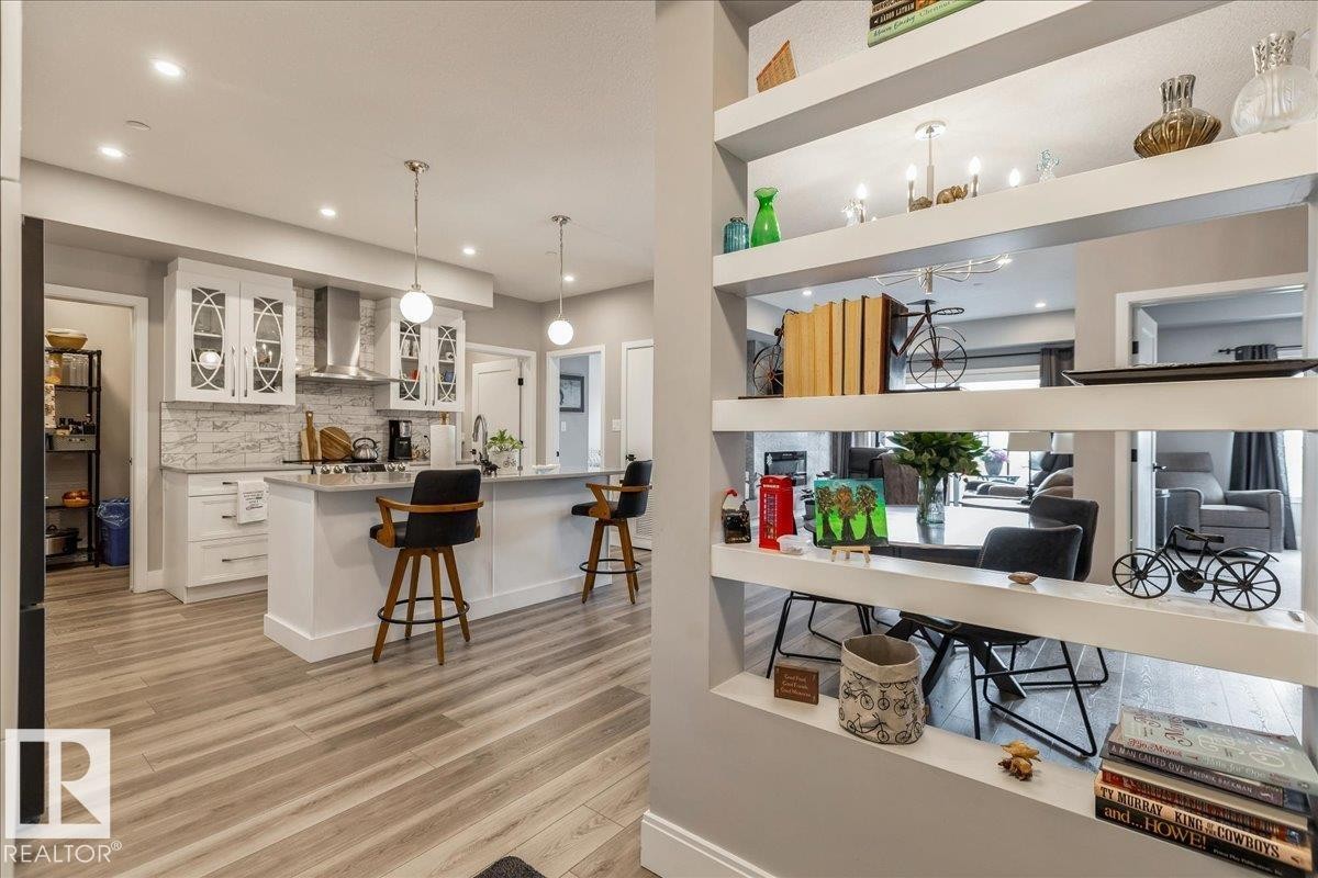 UNIT ENTRANCE WITH INTEGRATED SHELVING - 405 7463 May Common, Edmonton, AB - Indoor Photo Showing Kitchen With Upgraded Kitchen