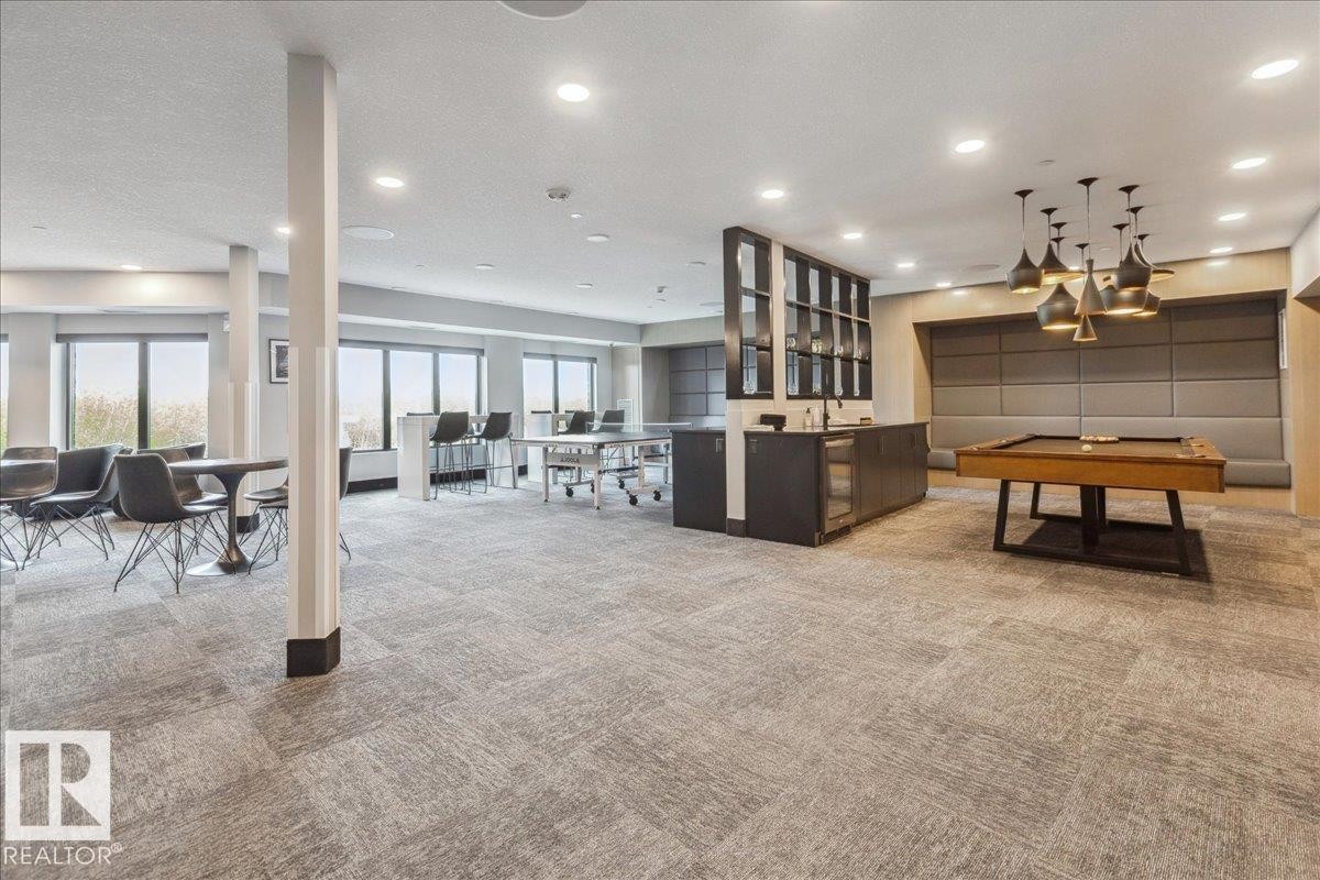 COMPLETE WITH POOL TABLE, TABLE TENNIS TABLE , DART BOARD, 2 BARS WITH FRIDGES, 2 BIG SCREEN TV'S, GAMES, VIDEO CONSOLES AND BLUETOOTH SOUND SYSTEM. AVAILABLE FOR OWNER S CASUAL USE OR PRIVATE RESERVATION - 405 7463 May Common, Edmonton, AB - Indoor