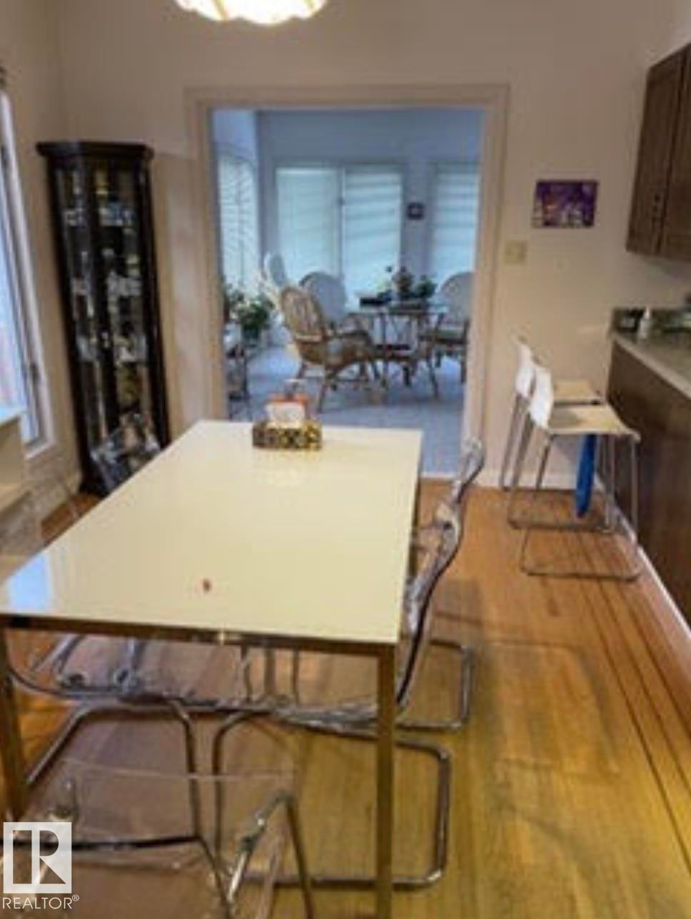 Hardwood-style flooring throughout the dining area - 9126 117 Street, Edmonton, AB