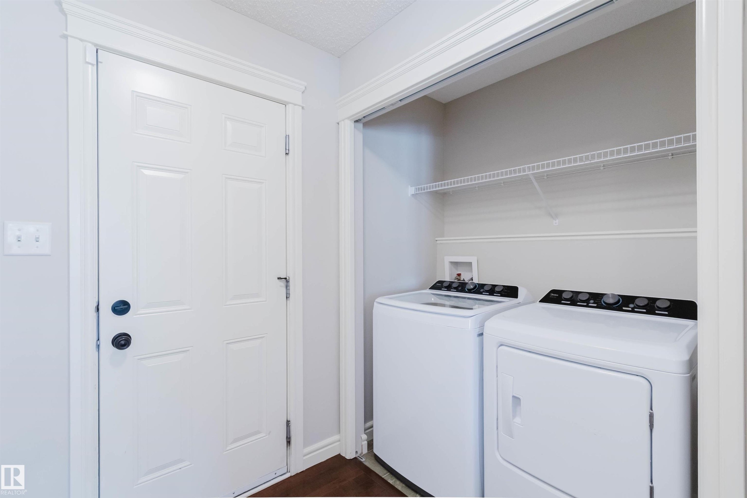 Dedicated laundry area featuring a wire shelf and connections for appliances - 1140 115 Street, Edmonton, AB - Indoor Photo Showing Laundry Room