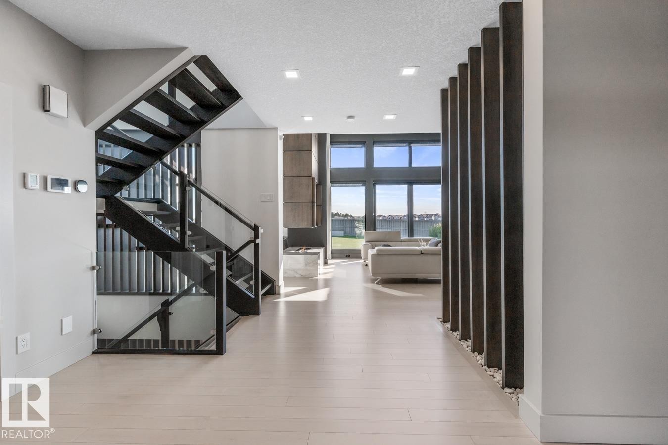 Front Entrance of the Home showing Grand Staircase and Main Living Area - 5536 Chegwin Point(E), Edmonton, AB - Indoor Photo Showing Other Room