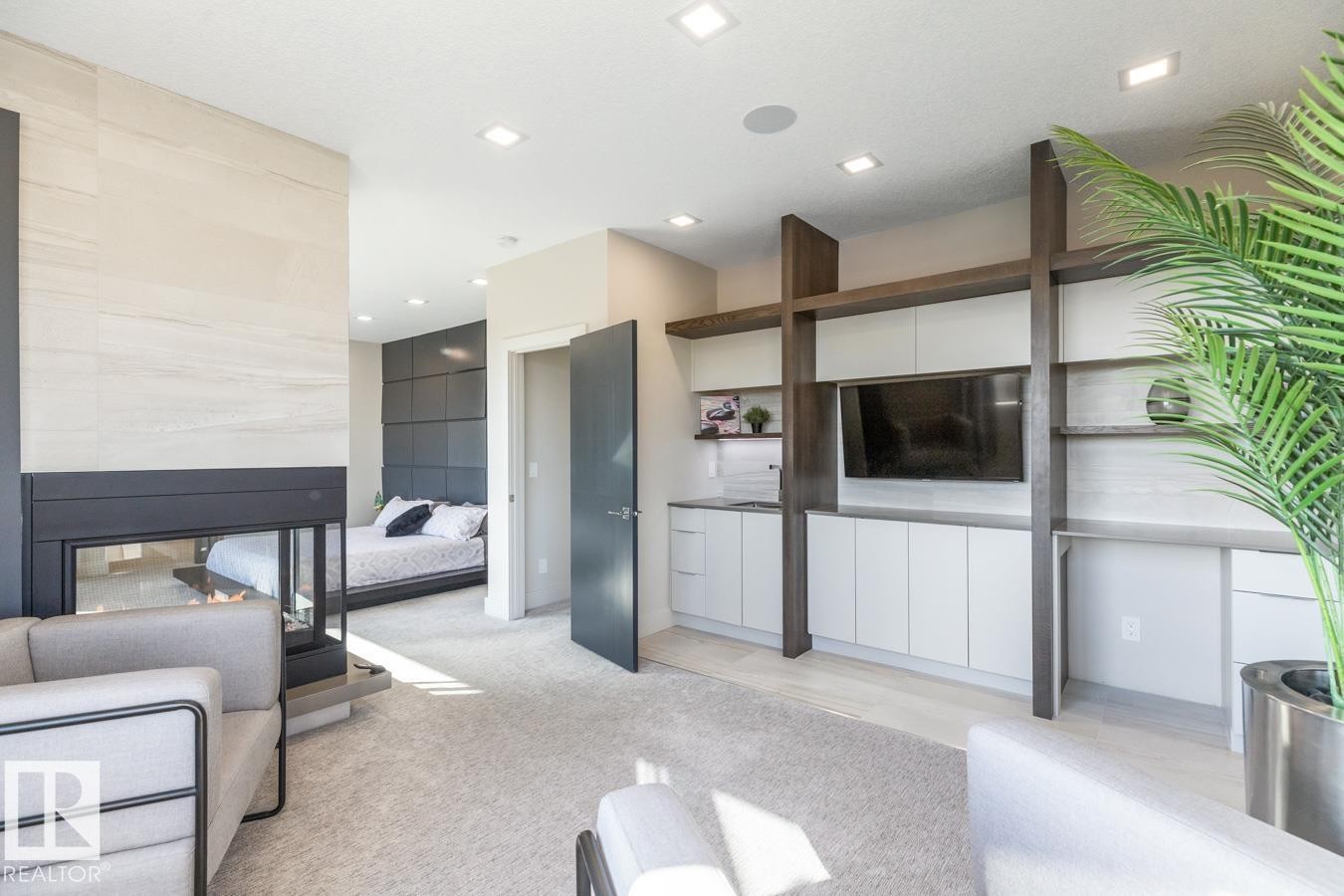 Huge Primary Bedroom featuring Private Sitting room with Wet Bar and Bar Fridge, Huge Ensuite Closet, Three Sided Fireplace, and Ensuite - 5536 Chegwin Point(E), Edmonton, AB - Indoor