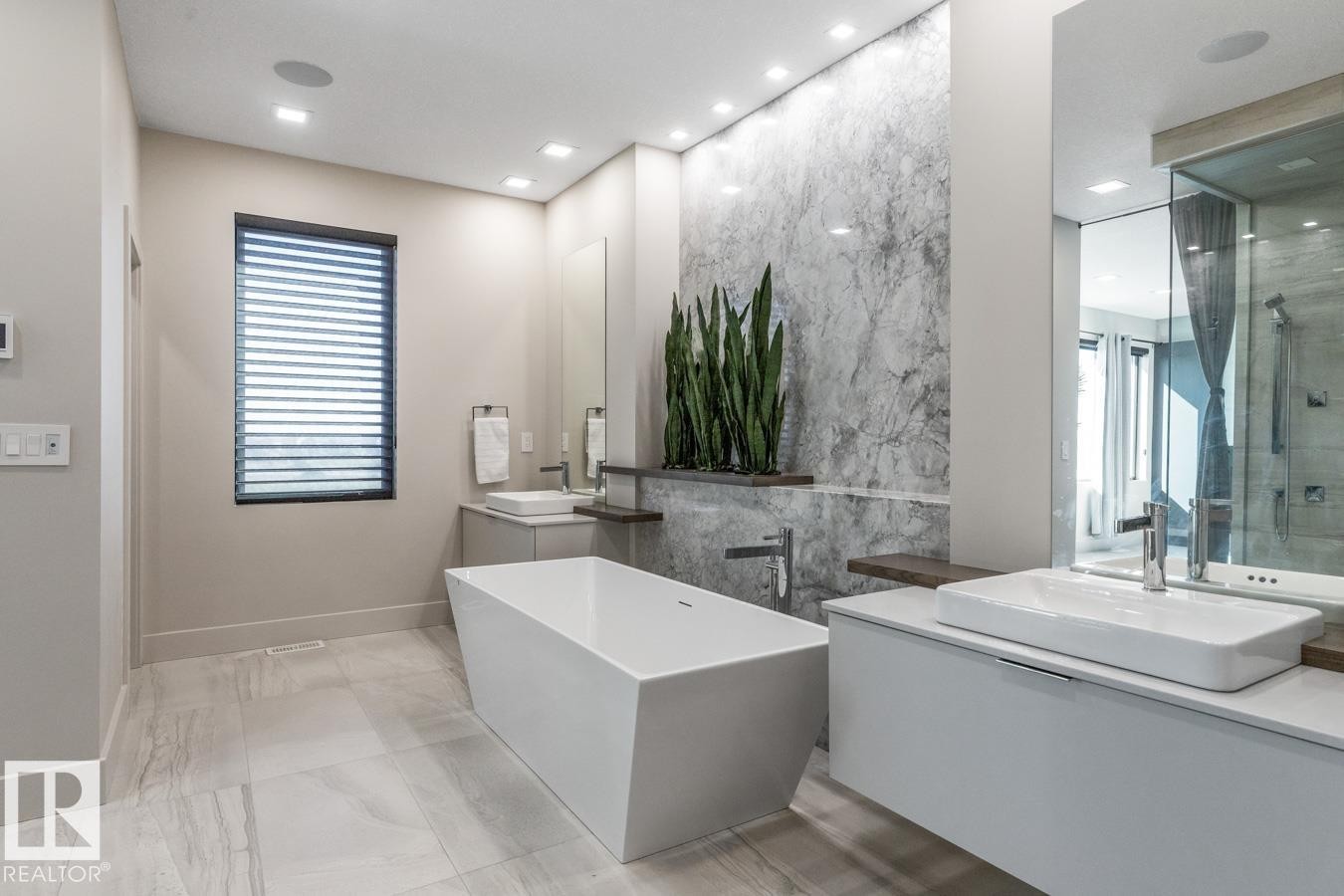 Primary 5 Piece Ensuite Bathroom featuring Glass Shower, Standalone Tub, Heated Floors, and Pass Through to Walk in Closet - 5536 Chegwin Point(E), Edmonton, AB - Indoor Photo Showing Bathroom