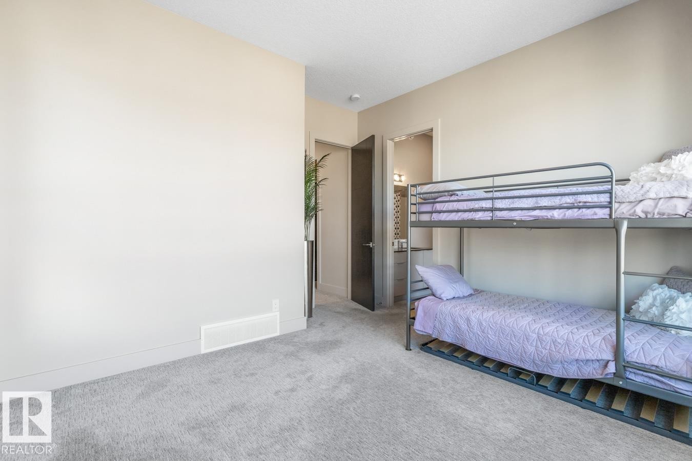 Upstairs Bedroom featuring Walk in Closet, Private Ensuite, and South West Facing Windows - 5536 Chegwin Point(E), Edmonton, AB - Indoor Photo Showing Bedroom