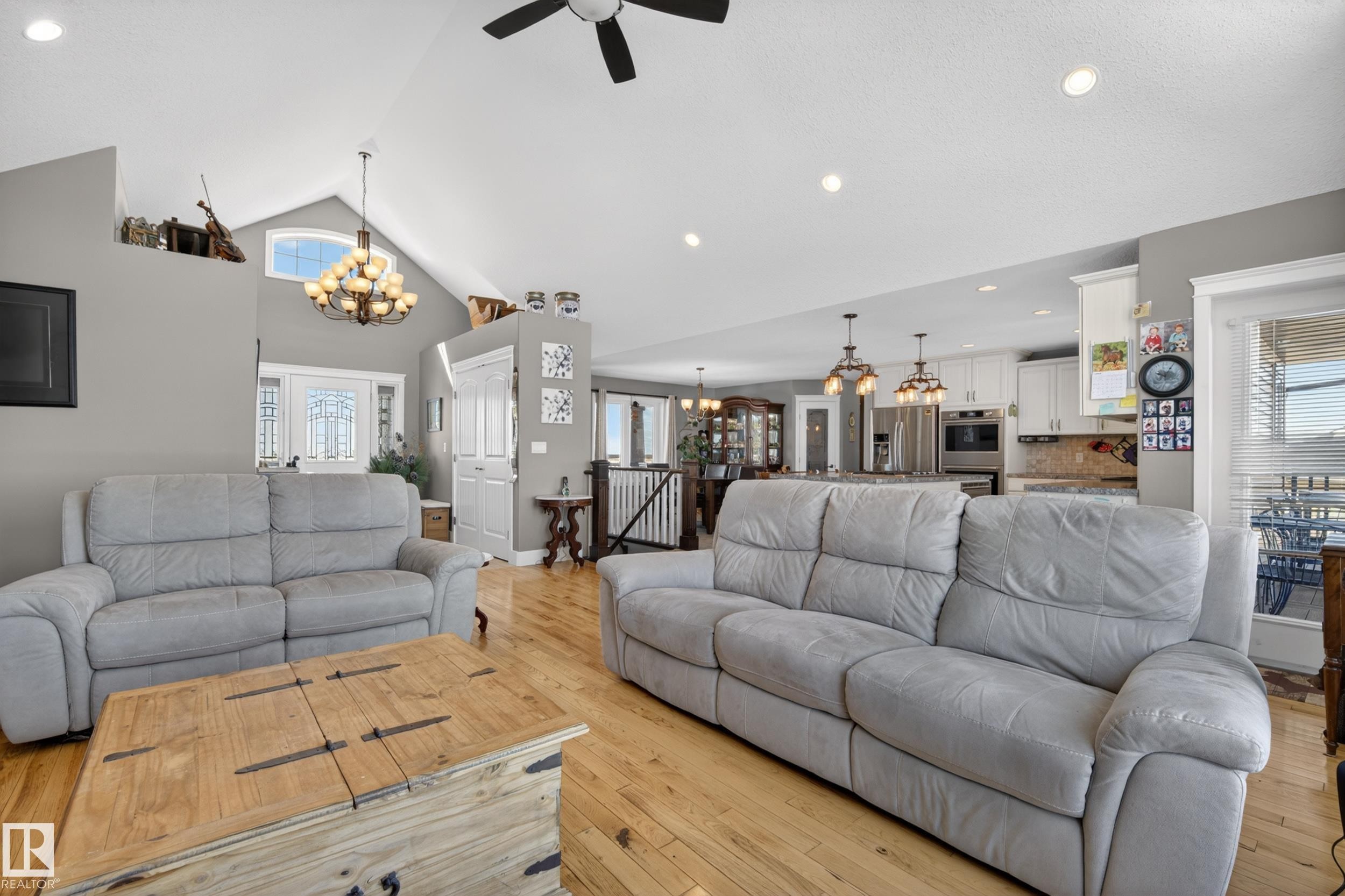 Dining area featuring tiled flooring, a decorative chandelier, and a large window providing views of the outdoors - 531064 Range Road 174, Rural Lamont County, AB - Indoor Photo Showing Dining Room