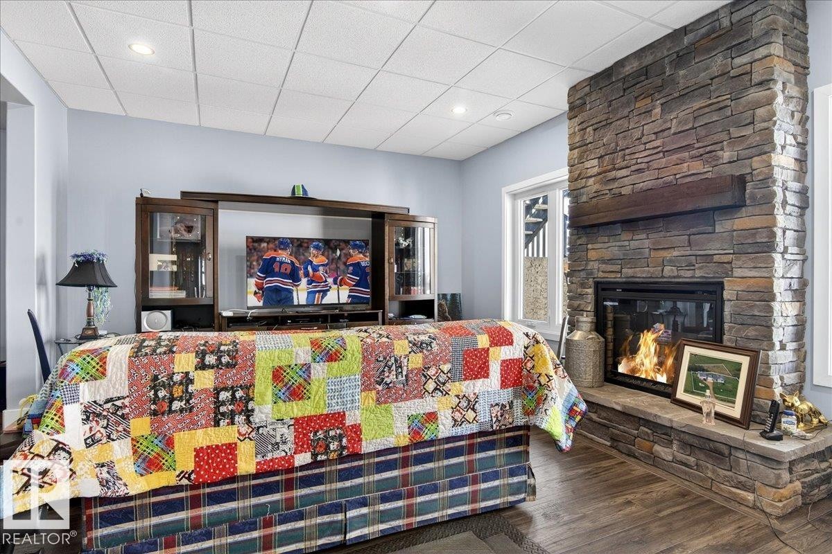 This versatile room features light blue walls, wood-style flooring, and a white grid ceiling with recessed lighting - 531064 Range Road 174, Rural Lamont County, AB - Indoor Photo Showing Office