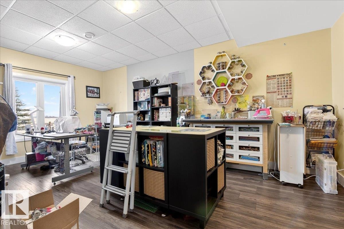 The property features extensive shelving and storage solutions, including wire racks and clear storage containers - 531064 Range Road 174, Rural Lamont County, AB - Indoor