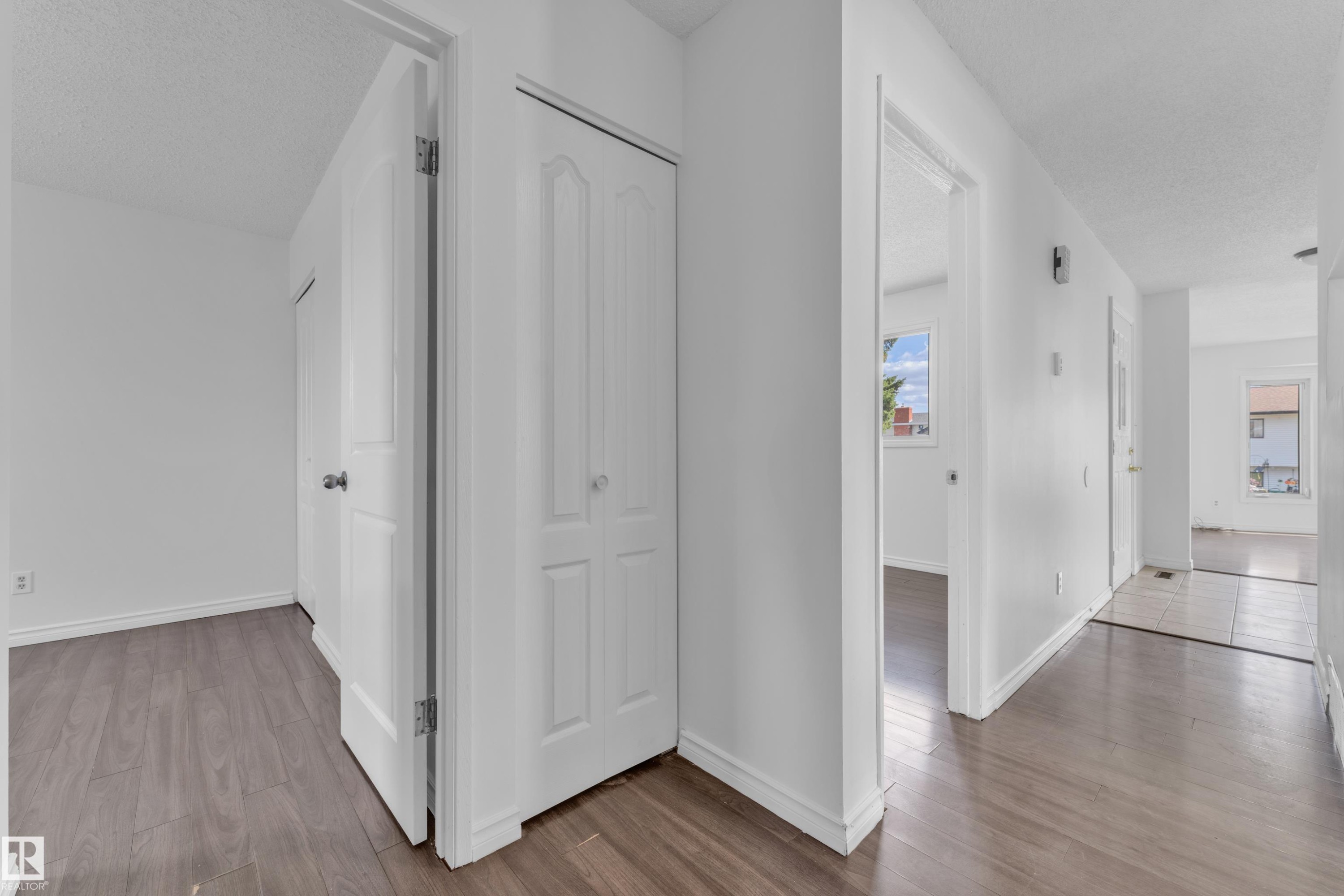 White interior walls with wood-finish flooring - 3520 19 Avenue, Edmonton, AB