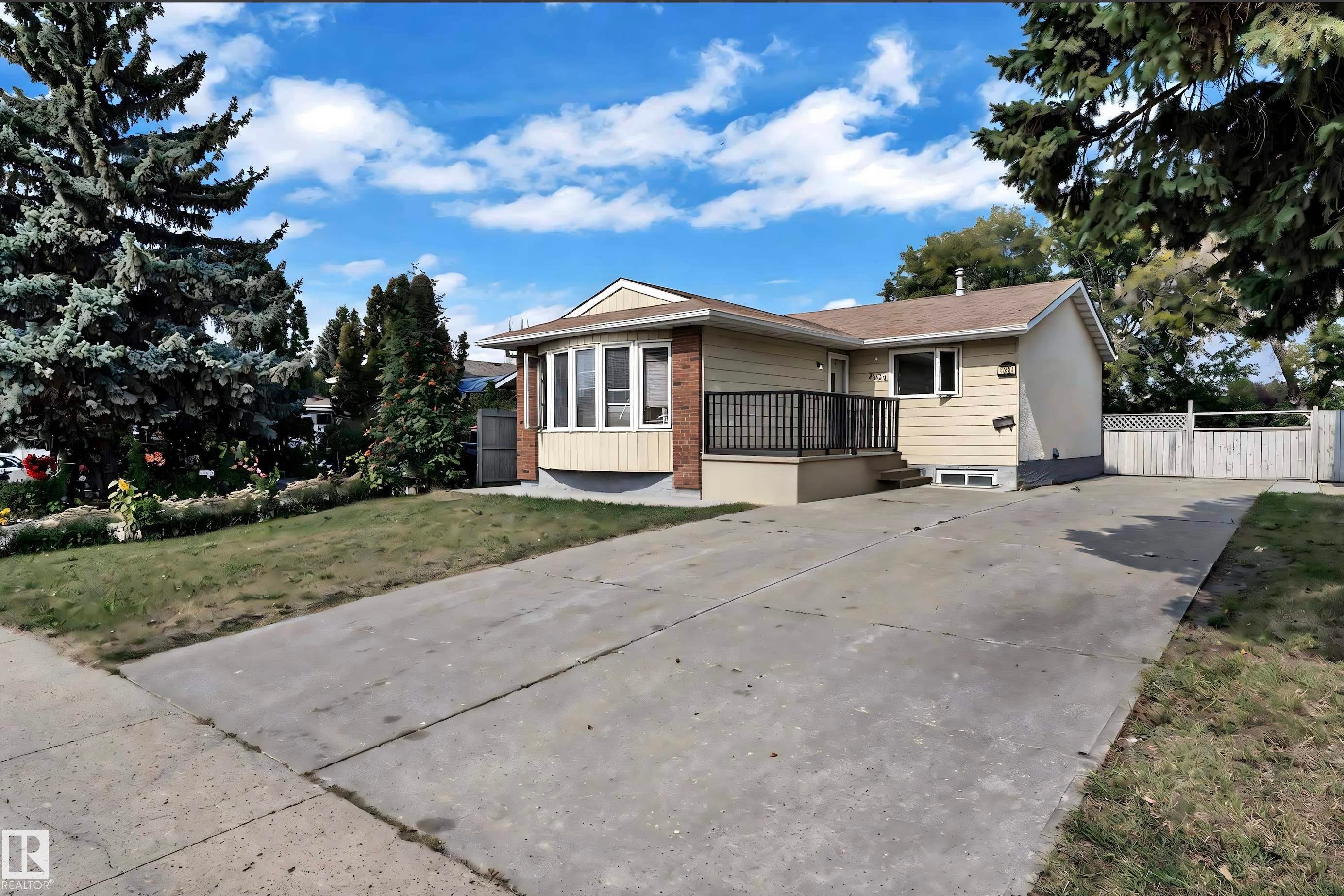 Ranch-style residence featuring a bay window and brick accent facade - 3520 19 Avenue, Edmonton, AB
