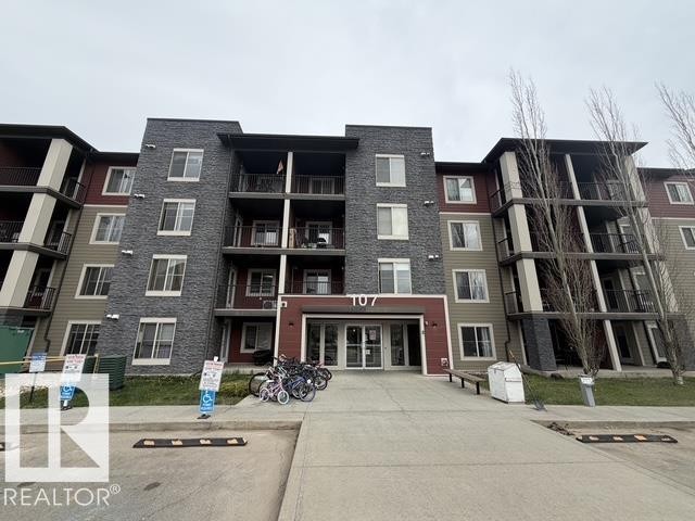 Modern multi-story building featuring a textured stone facade and varied siding - 321 107 Watt Common, Edmonton, AB - Outdoor With Balcony With Facade