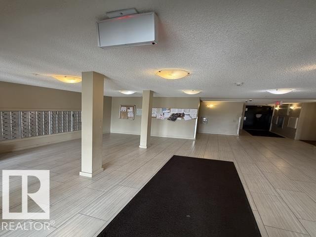 Building foyer featuring light-toned plank-style flooring - 321 107 Watt Common, Edmonton, AB - Indoor Photo Showing Other Room