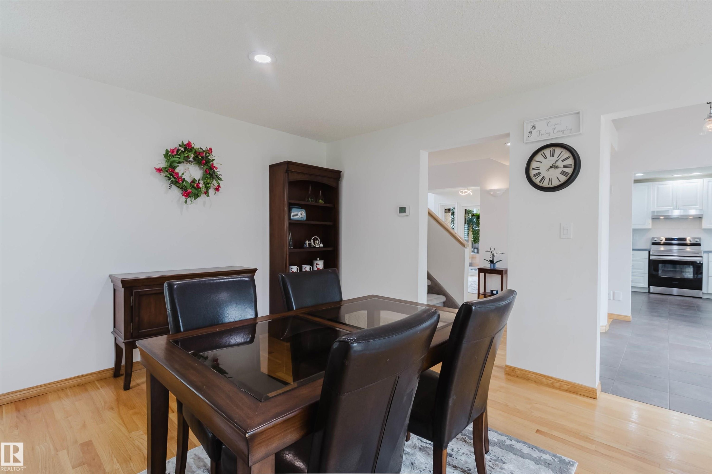 Dining area featuring wood-finish flooring, white walls, and recessed lighting - 342 O'Connor Close, Edmonton, AB - Indoor
