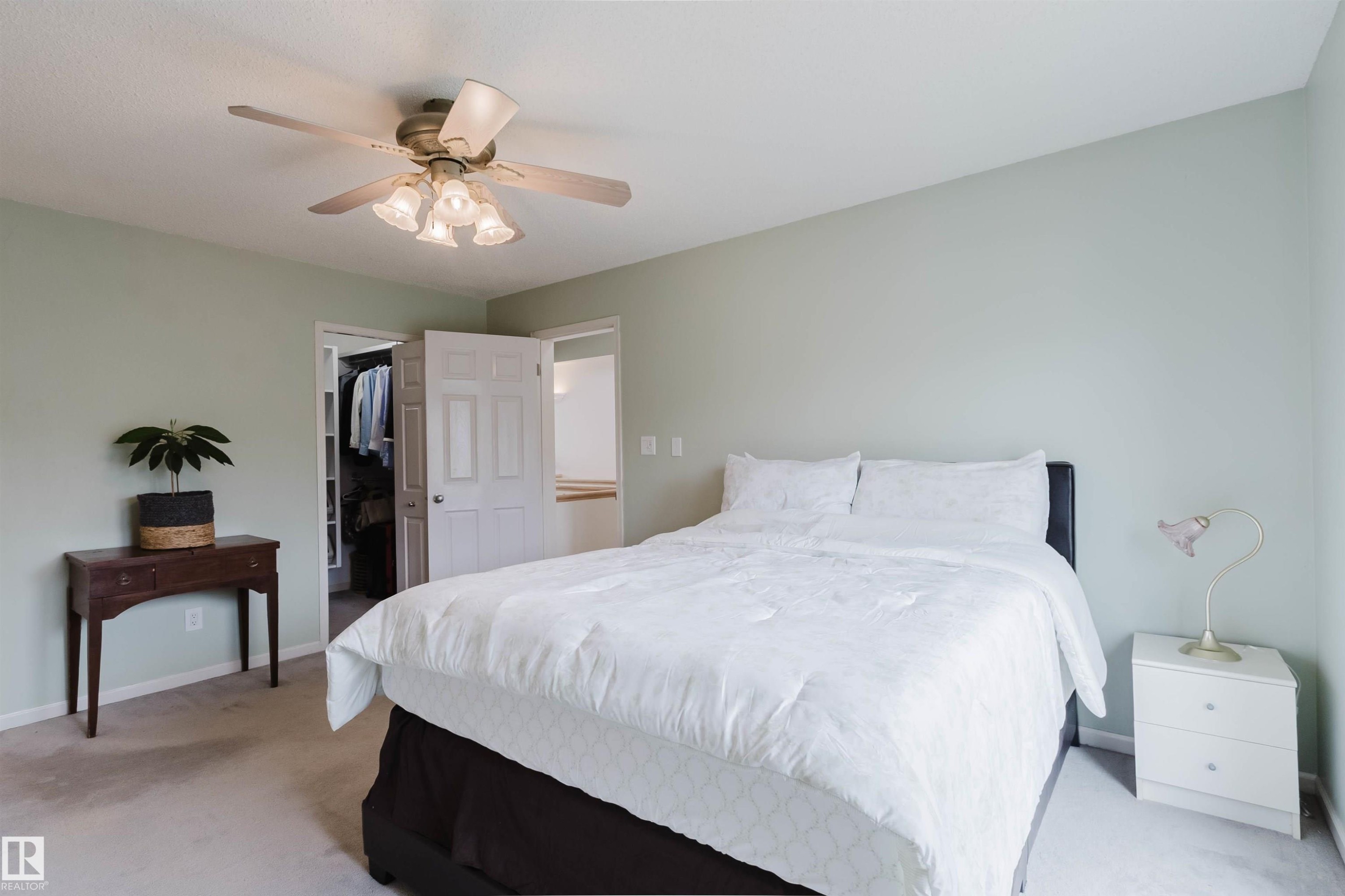 Carpeted room with light green walls and a ceiling fan with integrated lighting - 342 O'Connor Close, Edmonton, AB - Indoor Photo Showing Bedroom