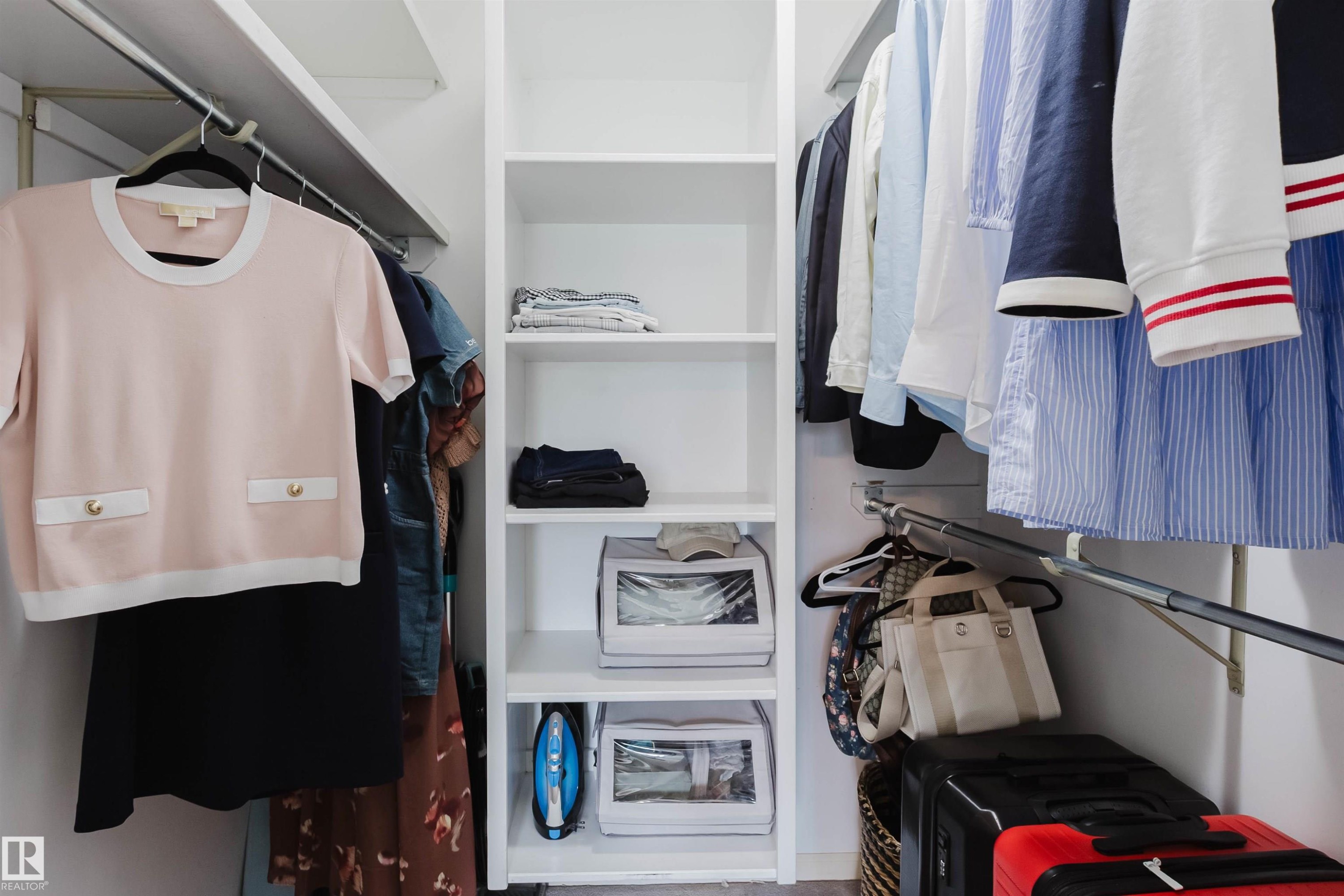 Built-in white shelving system with multiple hanging rods - 342 O'Connor Close, Edmonton, AB - Indoor With Storage