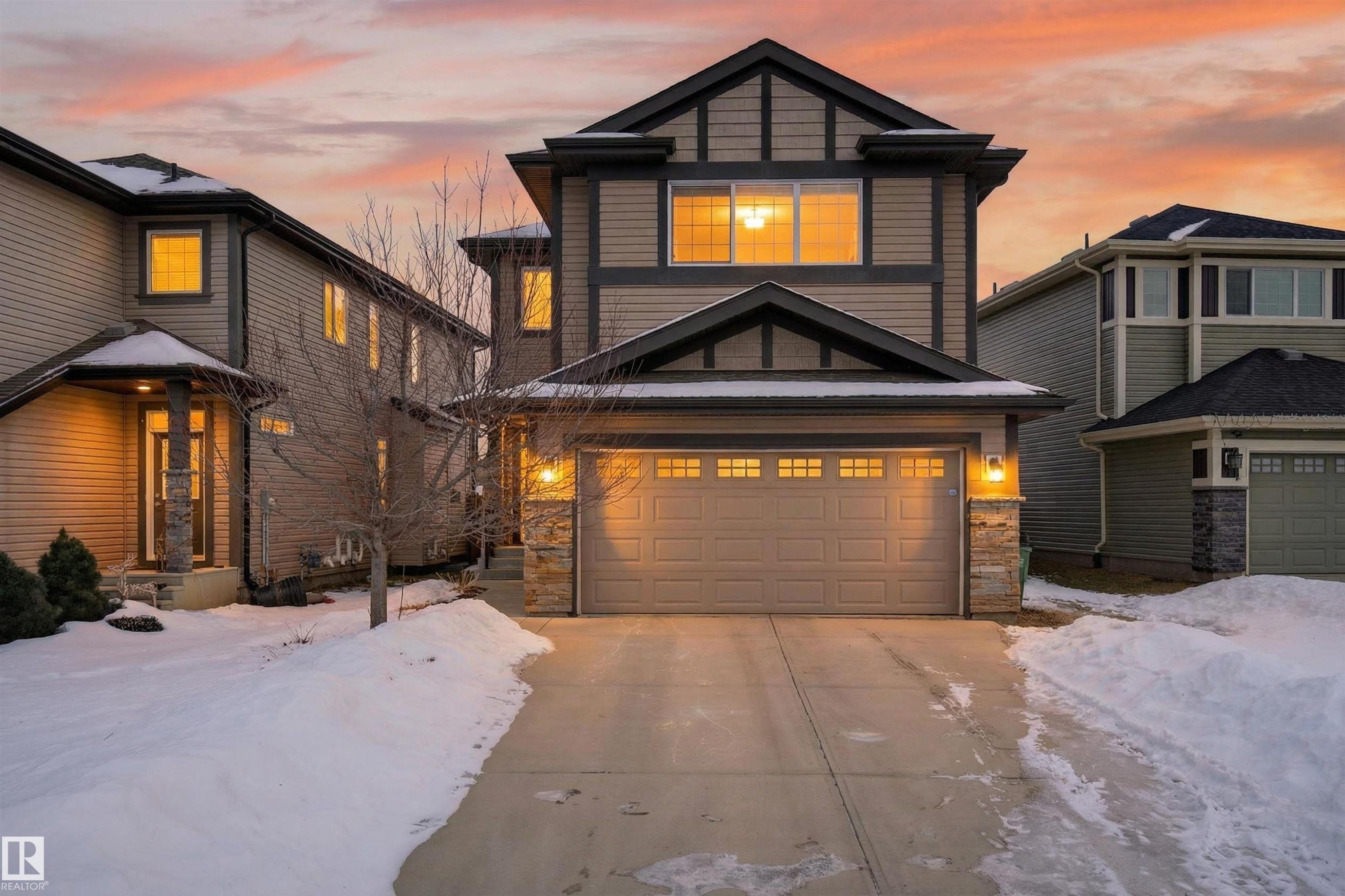 Two-story residence featuring a two-car garage with transom windows - 4723 Alwood Bend Sw, Edmonton, AB - Outdoor