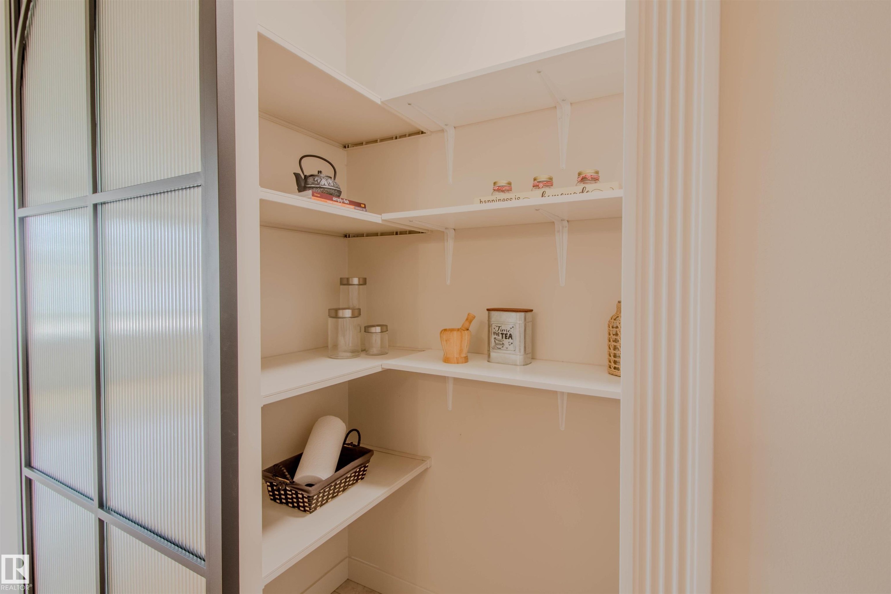 Built-in pantry shelving provides ample storage - 5935 189 Street, Edmonton, AB - Indoor Photo Showing Other Room