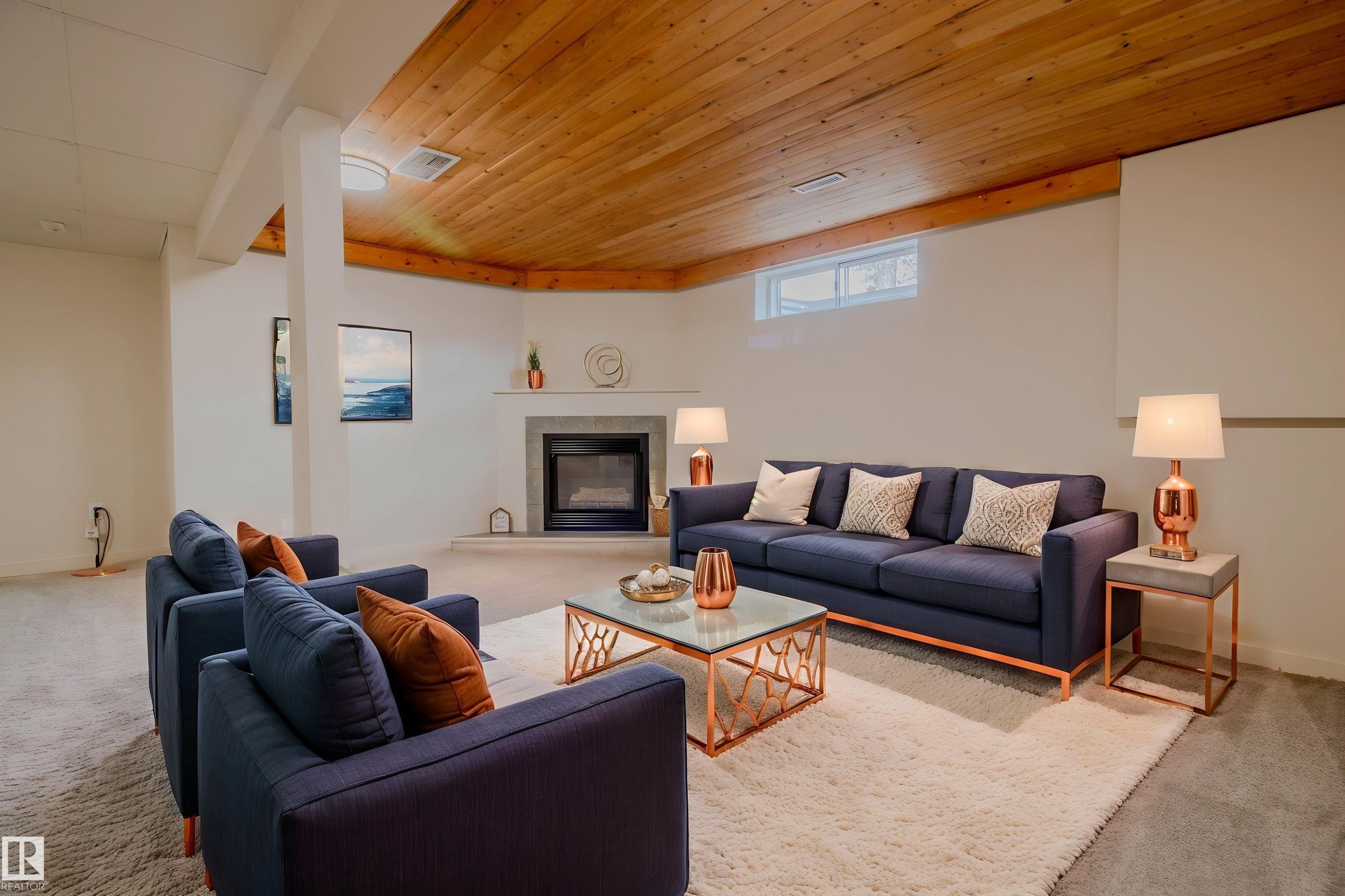 Wood-paneled ceiling accenting a neutral-toned room with plush carpeting - 5935 189 Street, Edmonton, AB - Indoor Photo Showing Living Room With Fireplace