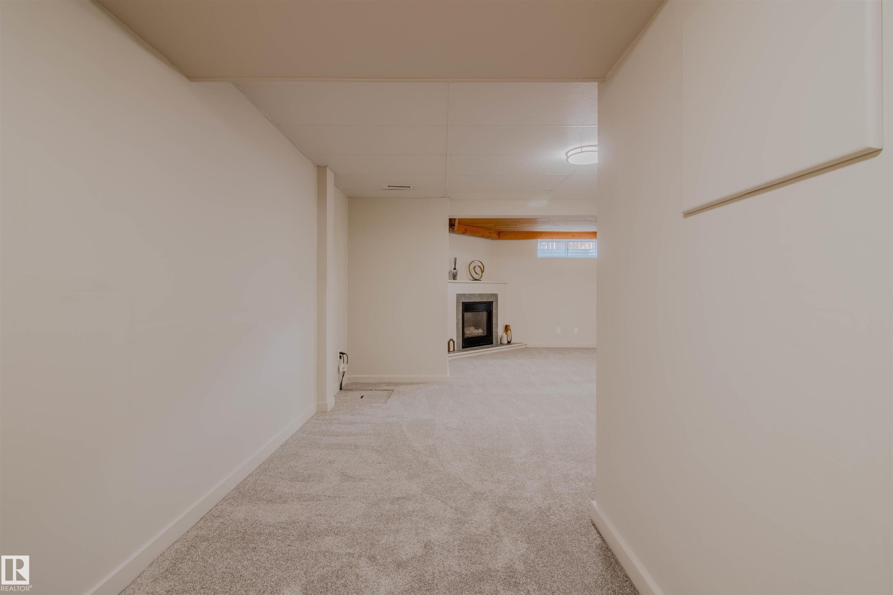 Spacious room with light-colored carpeting and white walls - 5935 189 Street, Edmonton, AB - Indoor Photo Showing Other Room