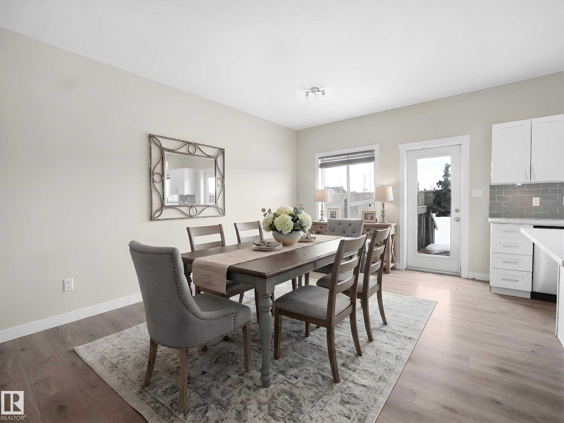 Open-concept dining area featuring light wood-finish flooring - 8921 217 Street Nw, Edmonton, AB - Indoor Photo Showing Dining Room
