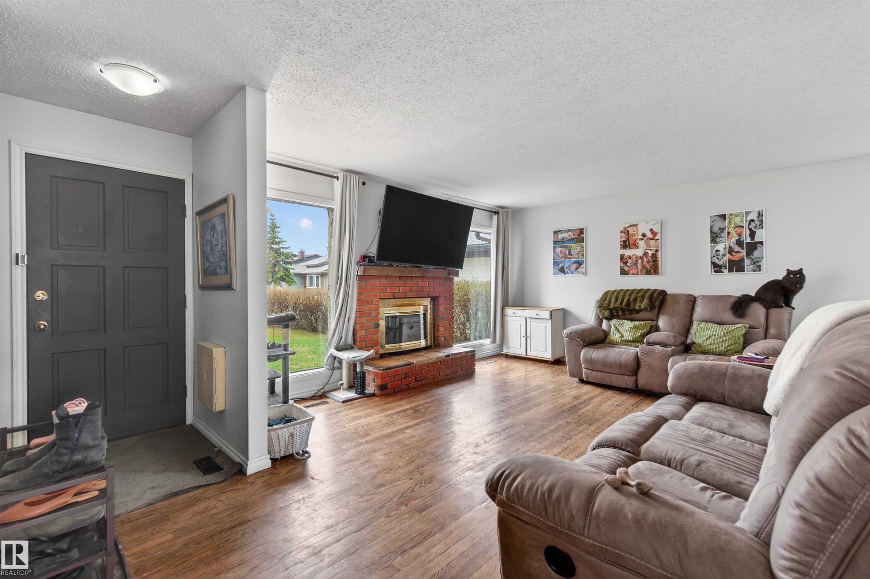 2012 2 Avenue, Cold Lake, AB - Indoor Photo Showing Living Room With Fireplace