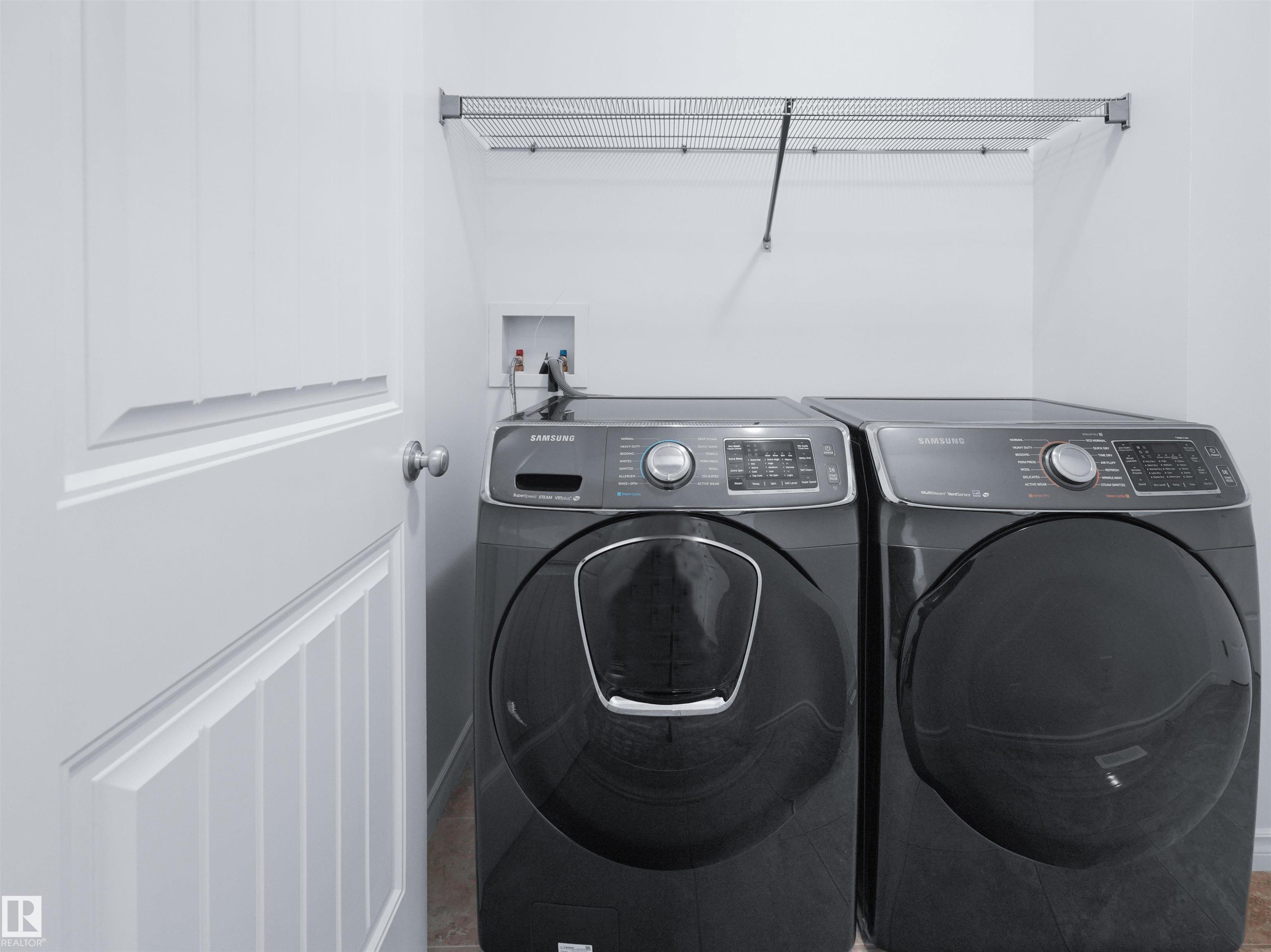 Dedicated laundry area with a wire shelving unit - 2017 32A Street, Edmonton, AB - Indoor Photo Showing Laundry Room