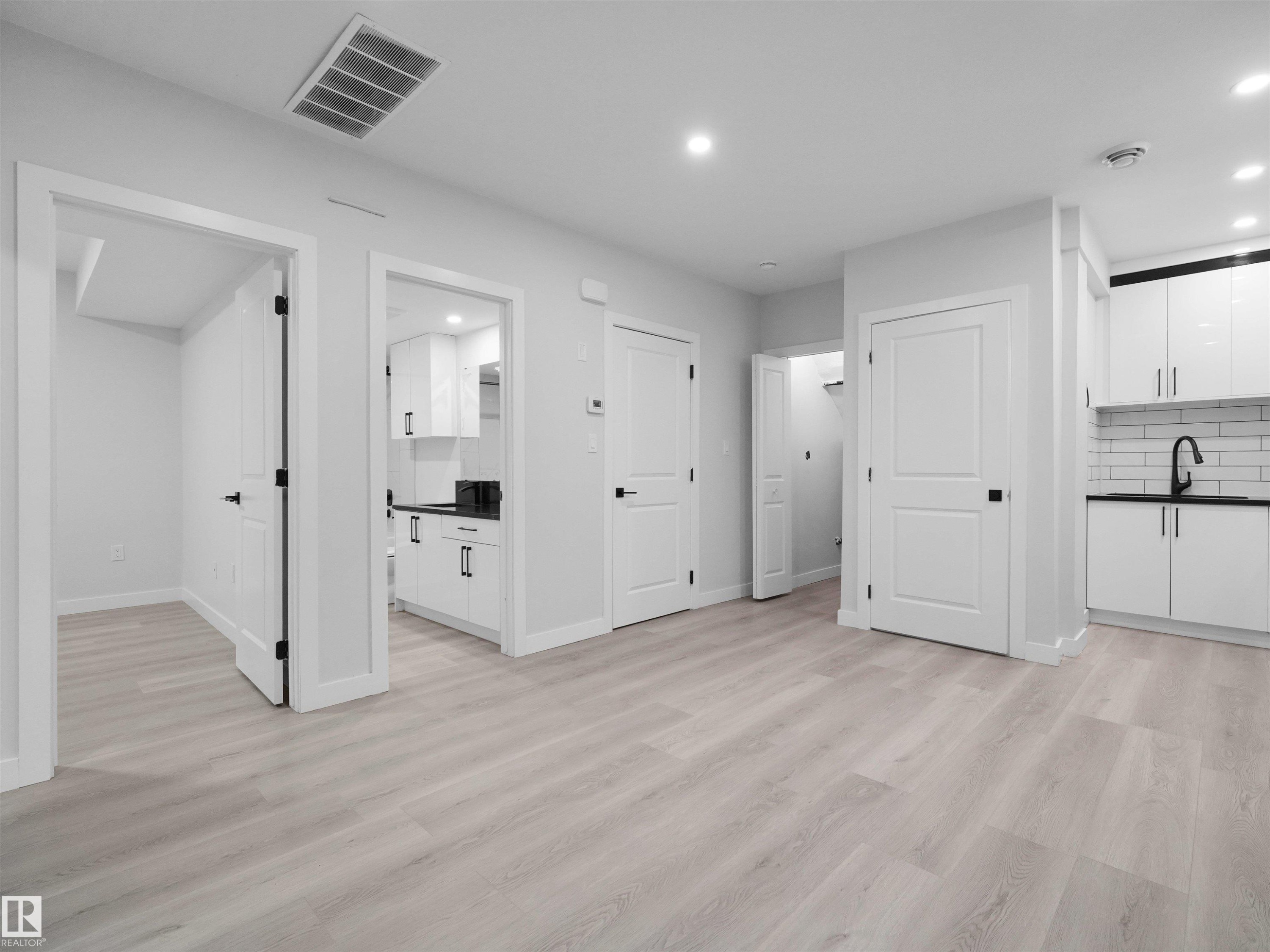 Light-toned wood-finish flooring throughout - 2017 32A Street, Edmonton, AB - Indoor