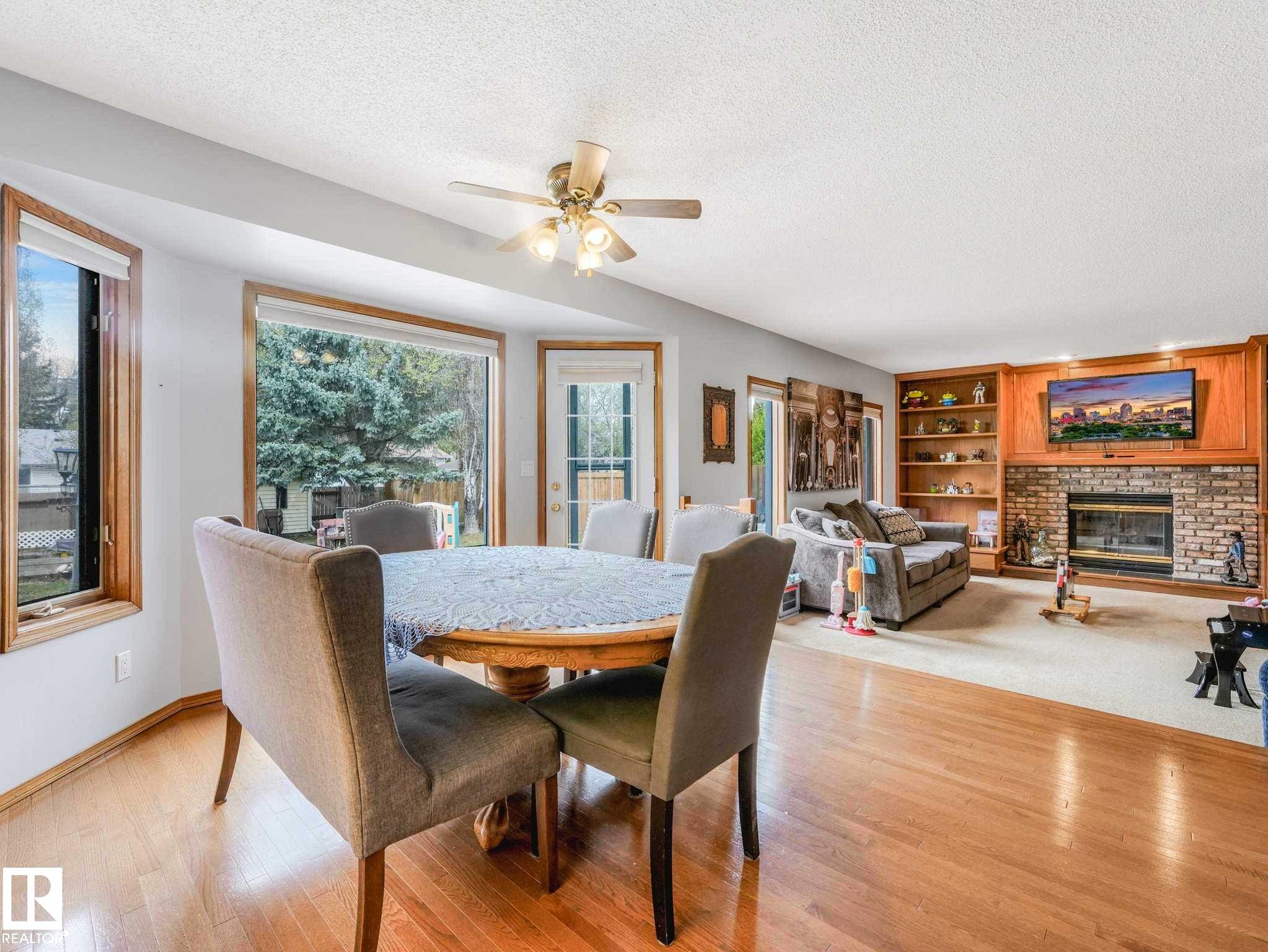 7 Haven, Devon, AB - Indoor Photo Showing Dining Room With Fireplace