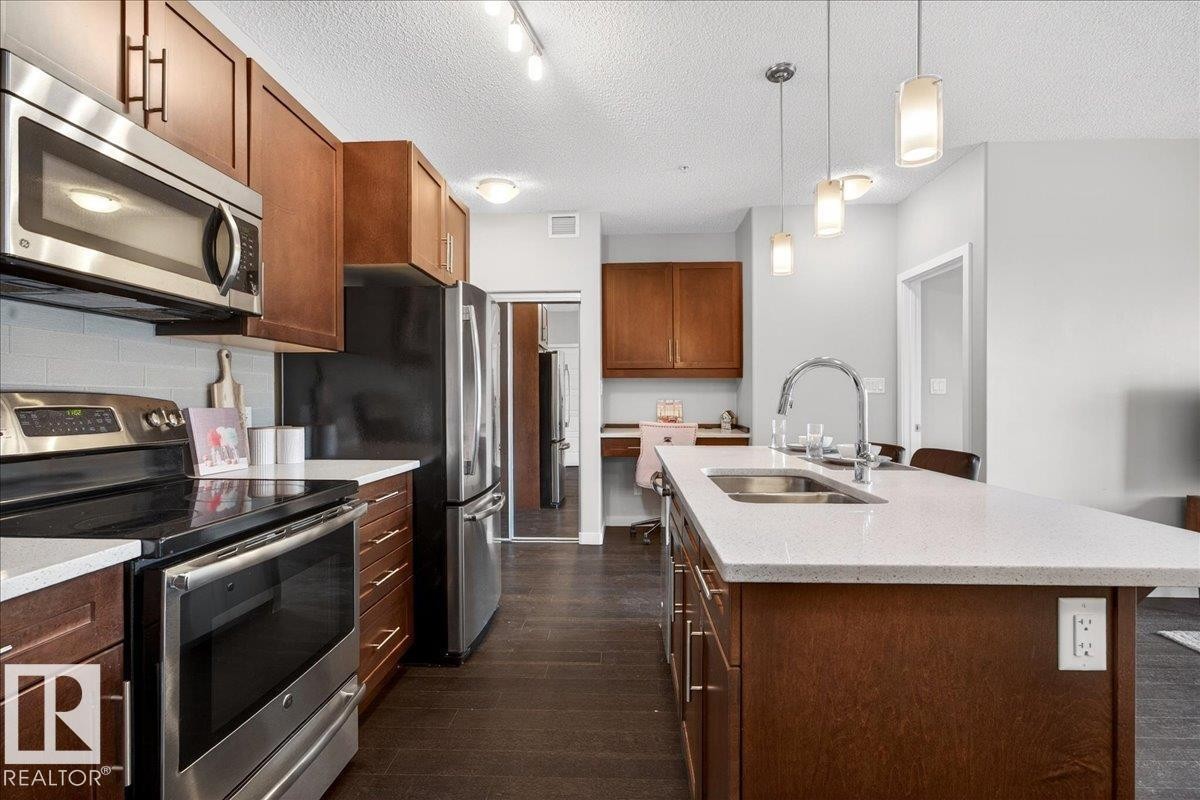 205 507 Albany Way, Edmonton, AB - Indoor Photo Showing Kitchen With Stainless Steel Kitchen With Double Sink With Upgraded Kitchen