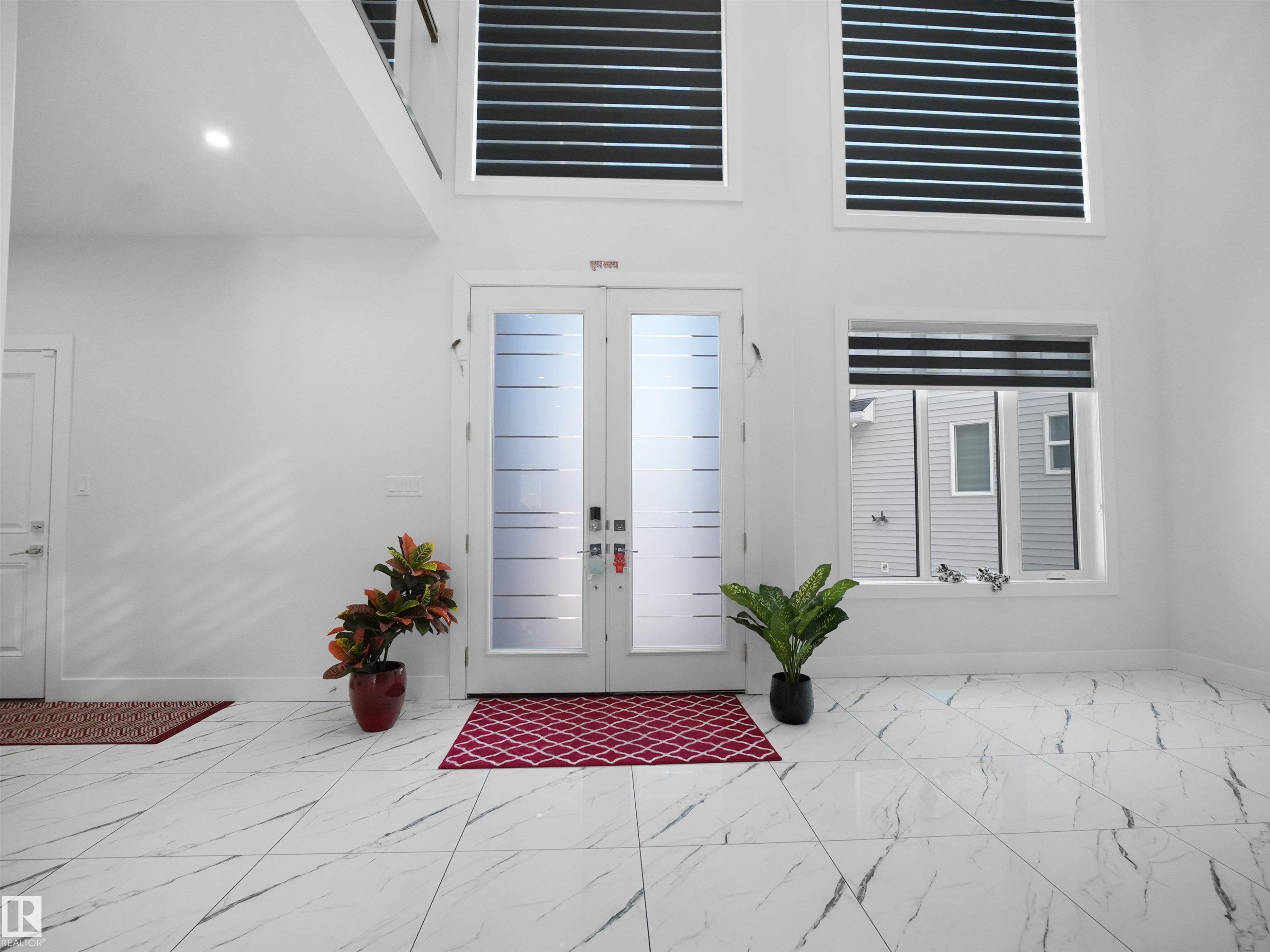 Double entry doors with privacy glass panels - 1208 25 St Nw, Edmonton, AB - Indoor Photo Showing Other Room
