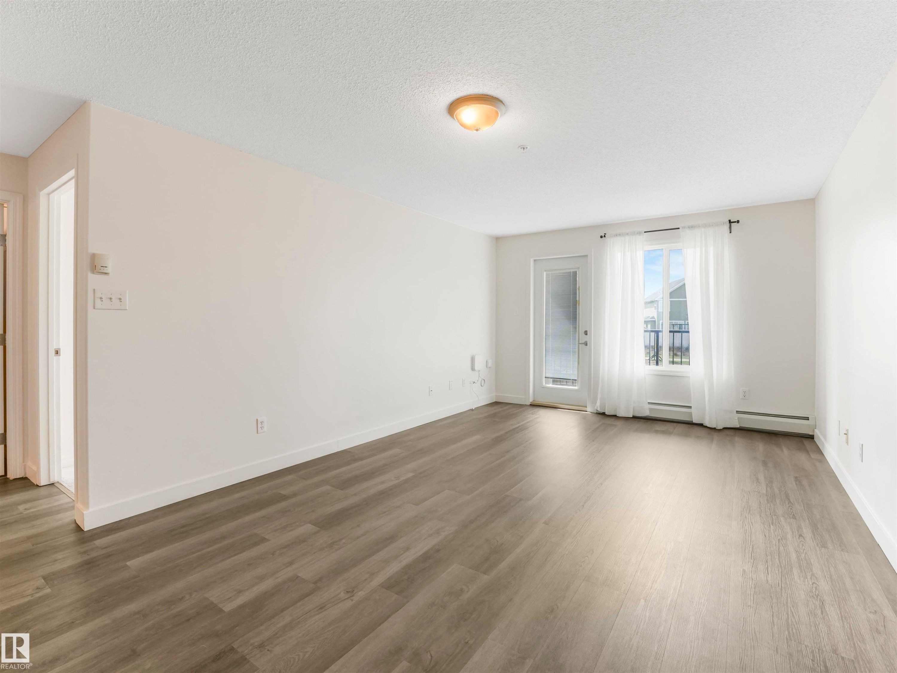 216 111 Edwards Drive, Edmonton, AB - Indoor Photo Showing Other Room