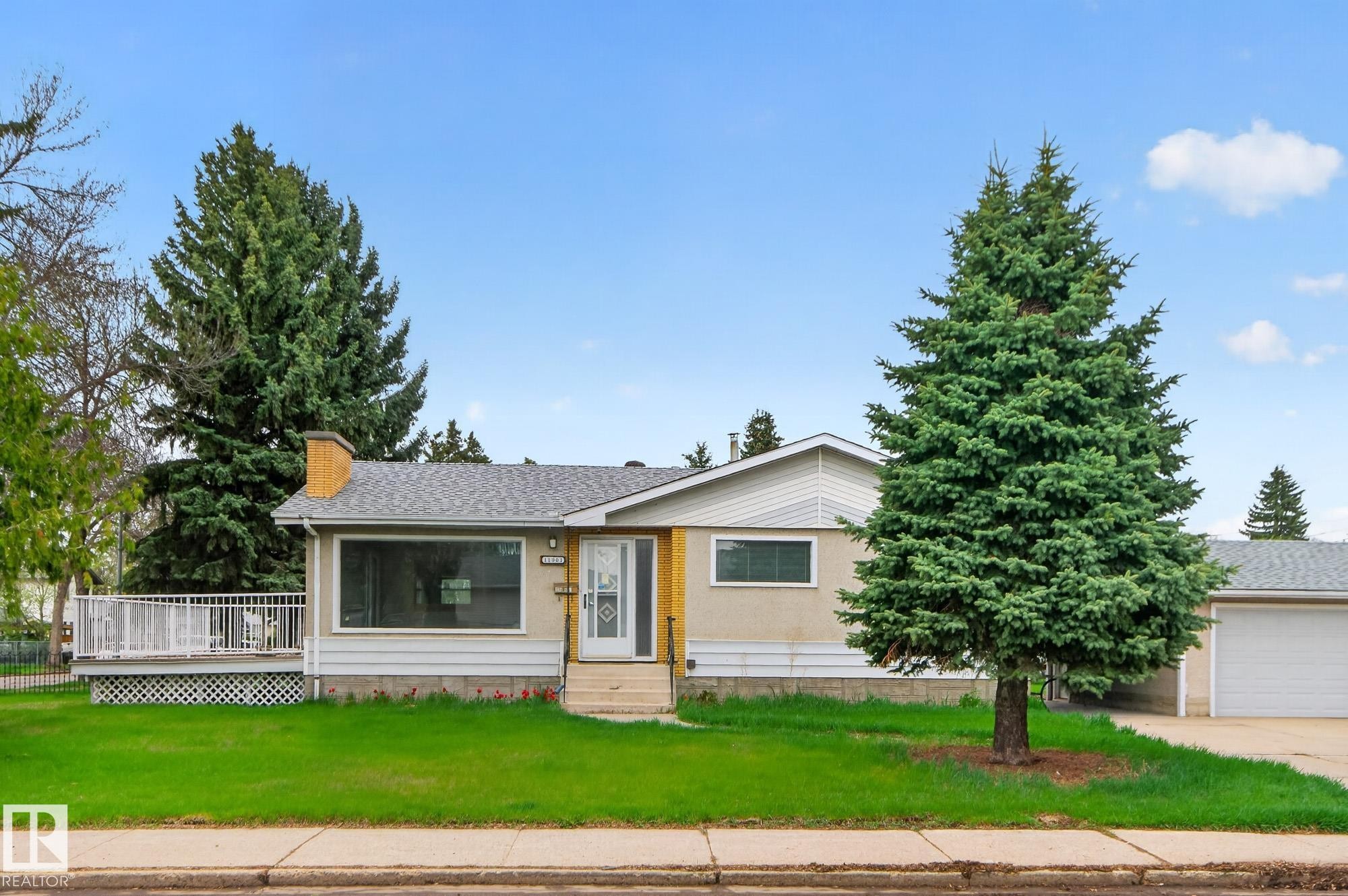 Ranch-style residence featuring a prominent front lawn, a white exterior, and a classic shingled roof - 11901 42 Street Nw, Edmonton, AB - Outdoor