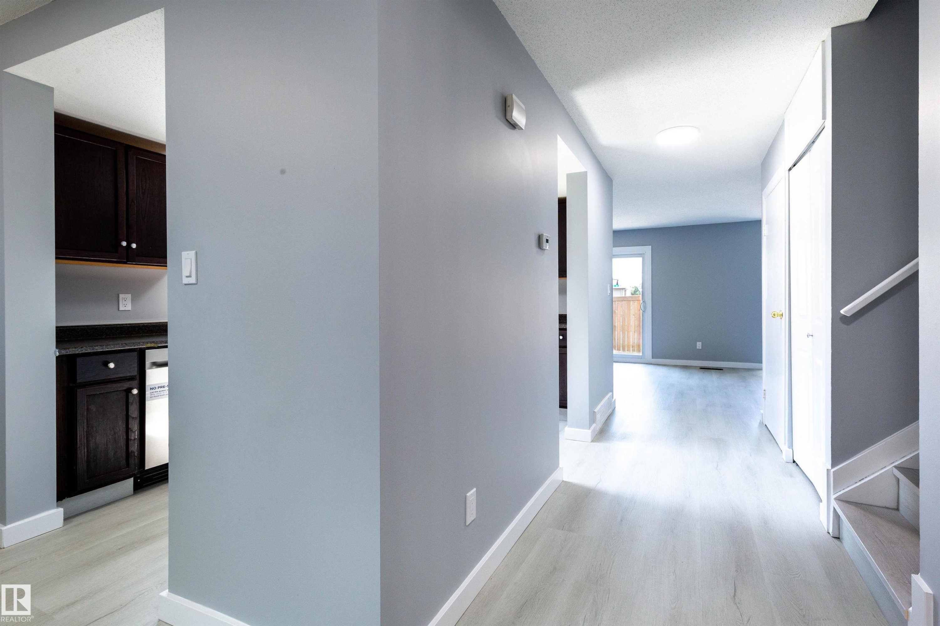 Bright entryway featuring light wood-finish flooring, white baseboards, and a skylight - 547 Dunluce Road, Edmonton, AB - Indoor Photo Showing Other Room