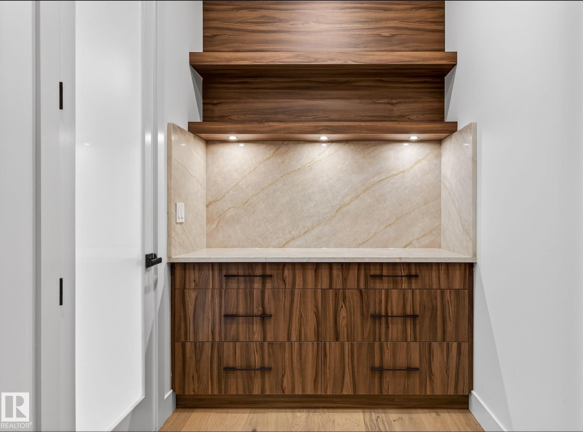 Custom built-in cabinetry featuring wood-finish paneling and dark hardware - 5820 110 Street, Edmonton, AB - Indoor Photo Showing Other Room