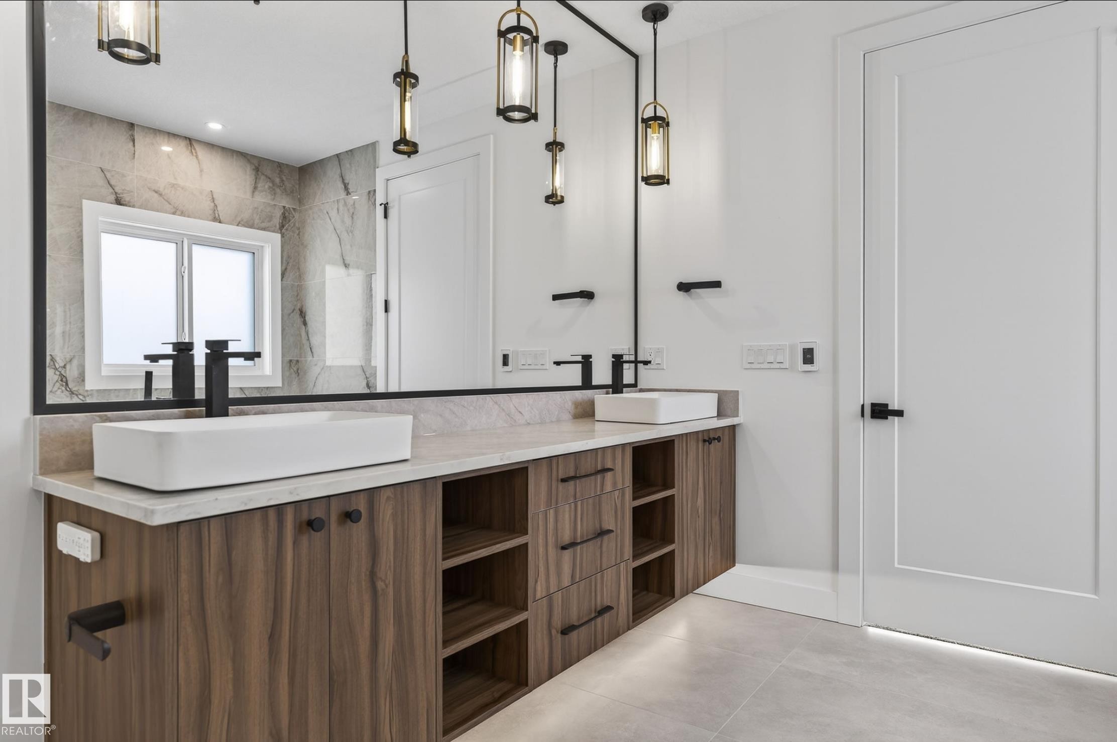 Contemporary double vanity featuring wood-finish cabinetry and light-toned countertops - 5820 110 Street, Edmonton, AB - Indoor Photo Showing Other Room