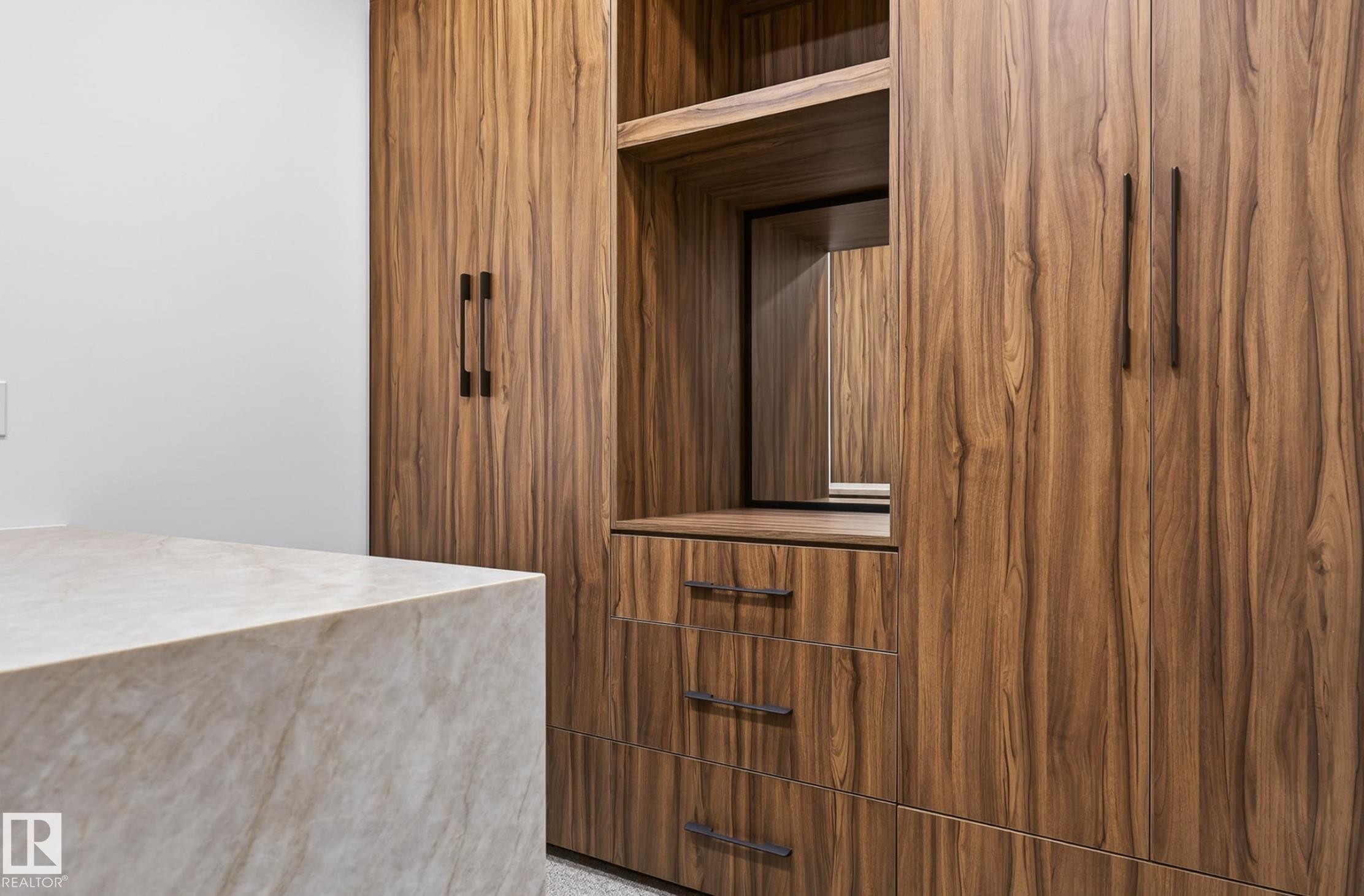 Custom built-in cabinetry with wood-finish doors and dark hardware - 5820 110 Street, Edmonton, AB - Indoor Photo Showing Other Room