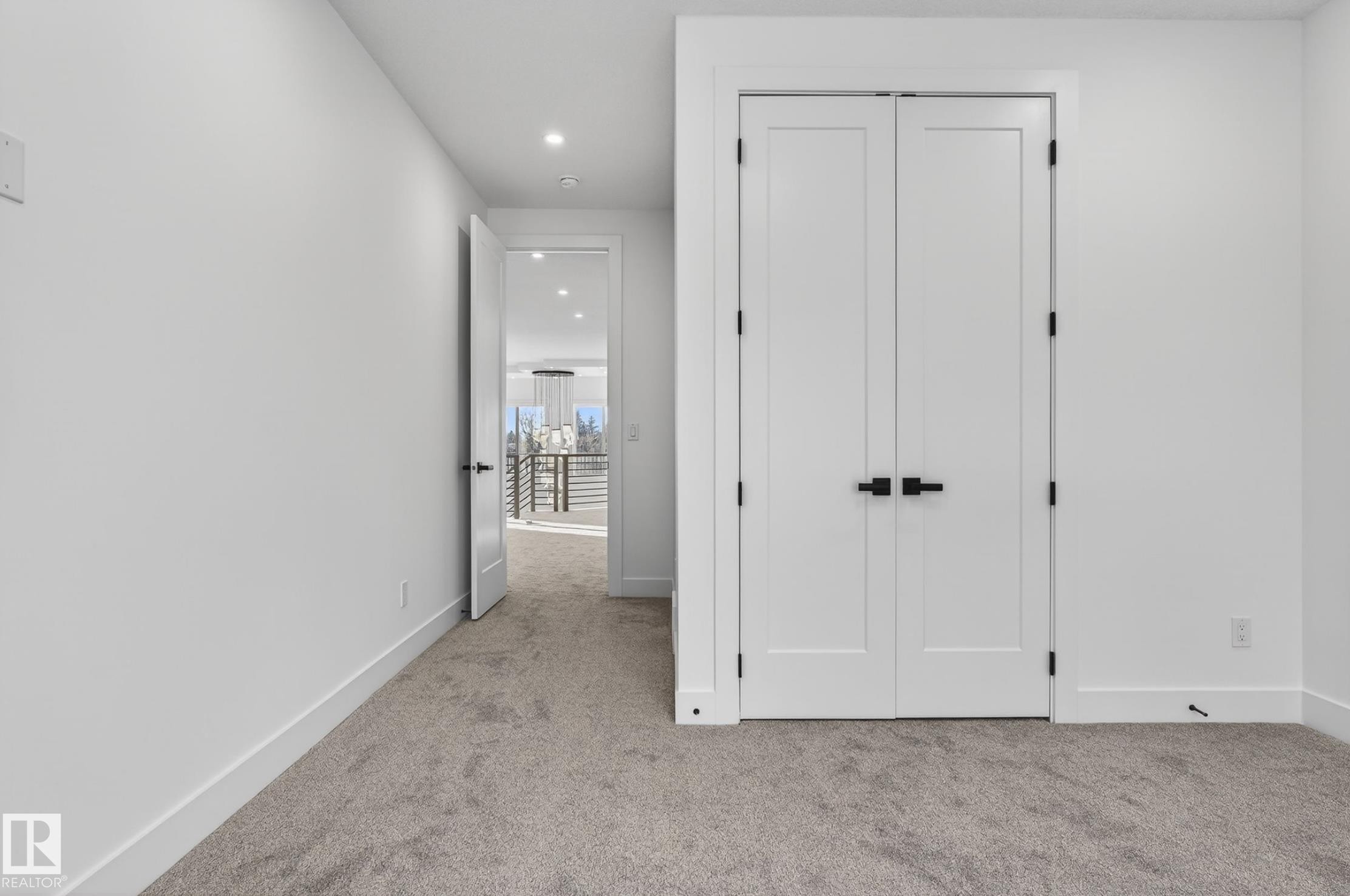 Double panel doors with matte black hardware - 5820 110 Street, Edmonton, AB - Indoor Photo Showing Other Room