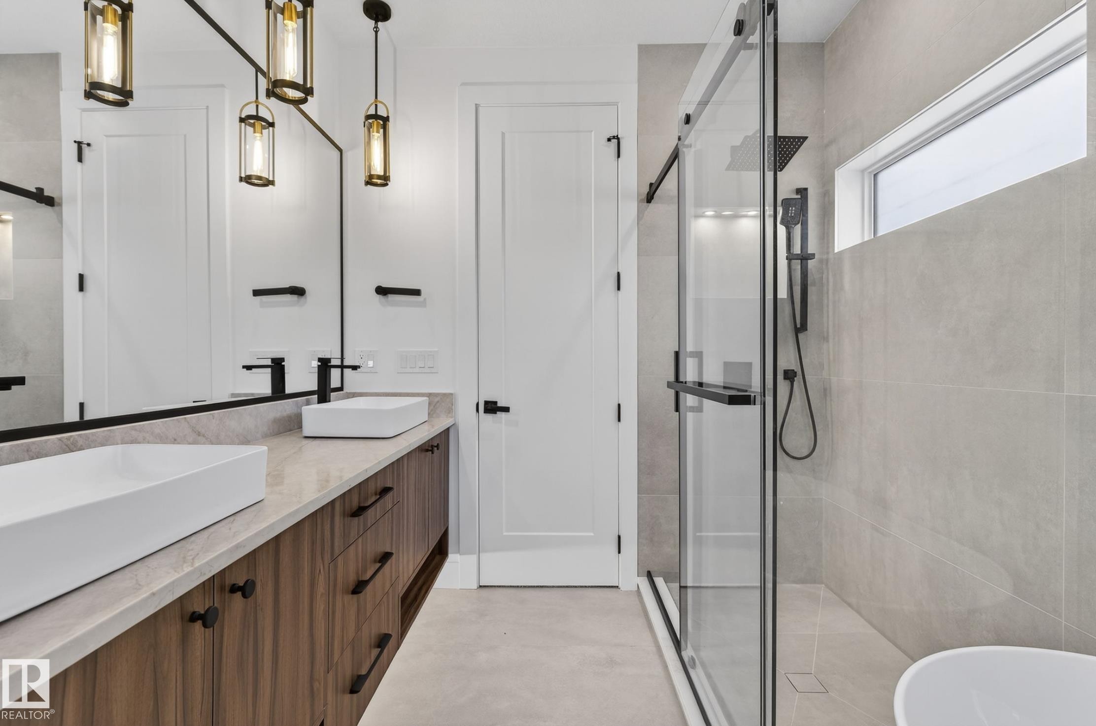 Contemporary bathroom featuring a dual vanity with wood-finish cabinetry and rectangular vessel sinks - 5820 110 Street, Edmonton, AB - Indoor Photo Showing Bathroom