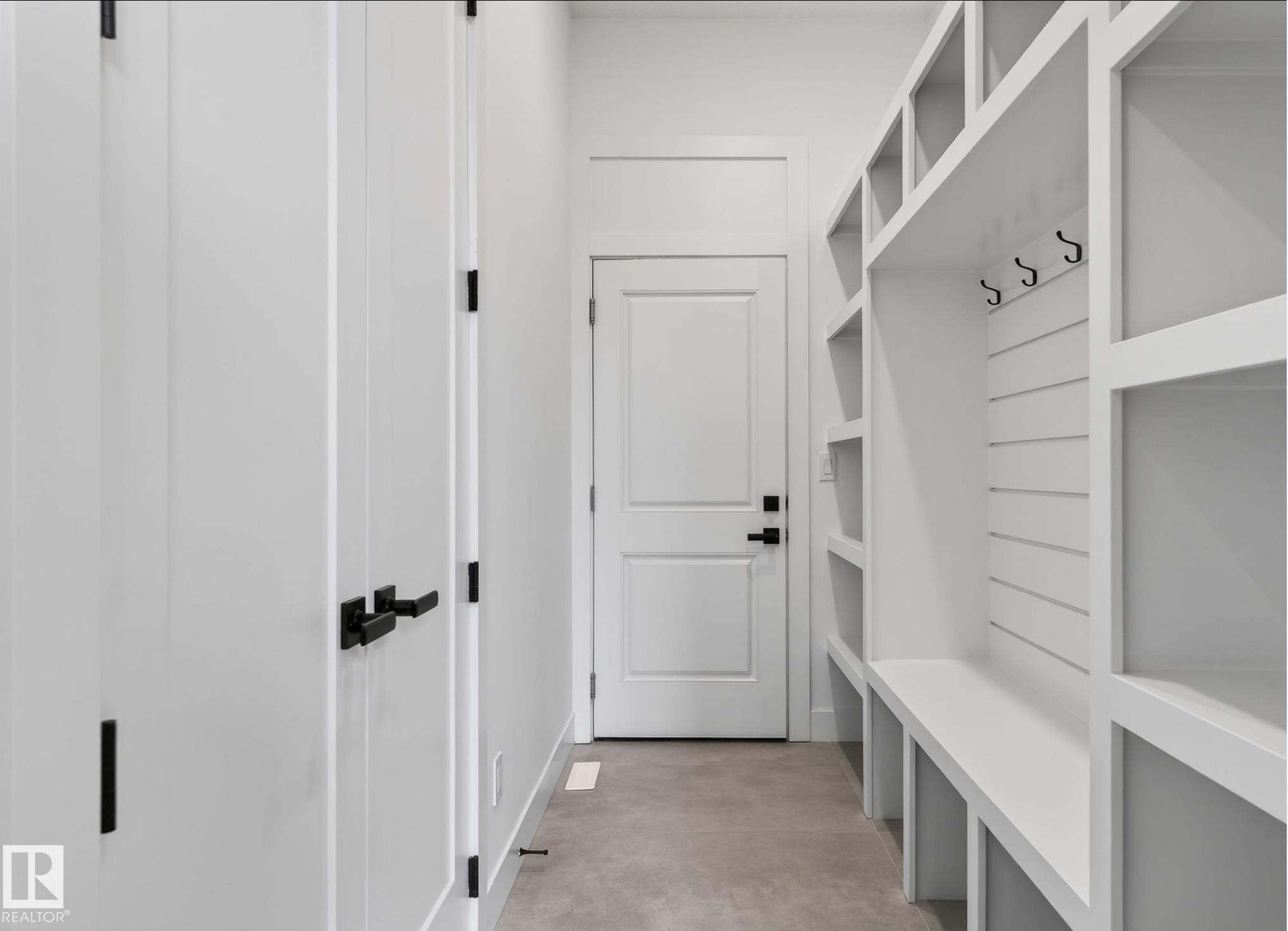 Mudroom featuring a built-in storage system with cubbies and a bench - 5820 110 Street, Edmonton, AB - Indoor Photo Showing Other Room
