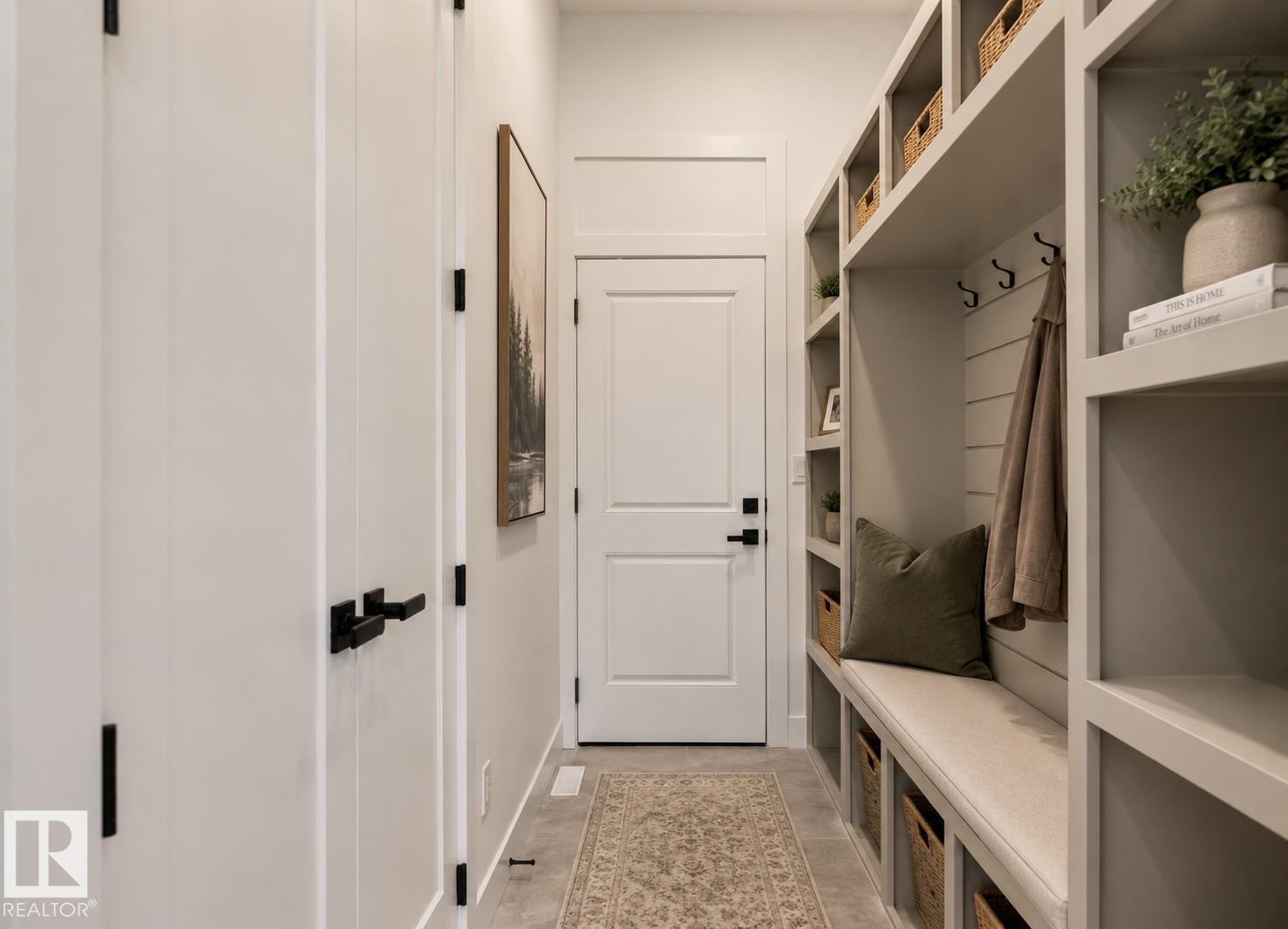 Built-in mudroom organization system featuring open shelving, integrated bench seating, storage cubbies, and coat hooks - 5820 110 Street, Edmonton, AB - Indoor Photo Showing Other Room