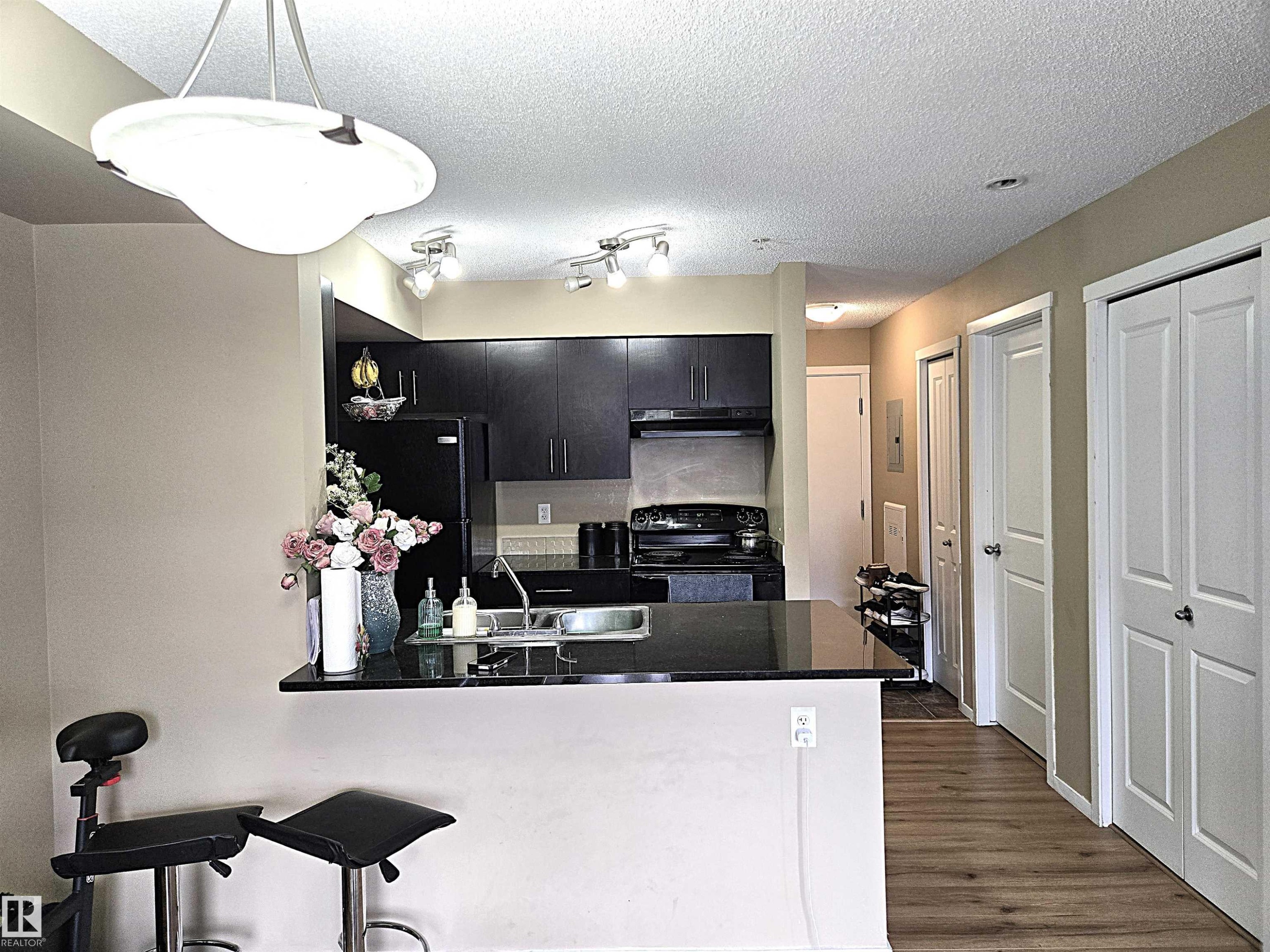 210 3207 James Mowatt Trail, Edmonton, AB - Indoor Photo Showing Kitchen With Double Sink