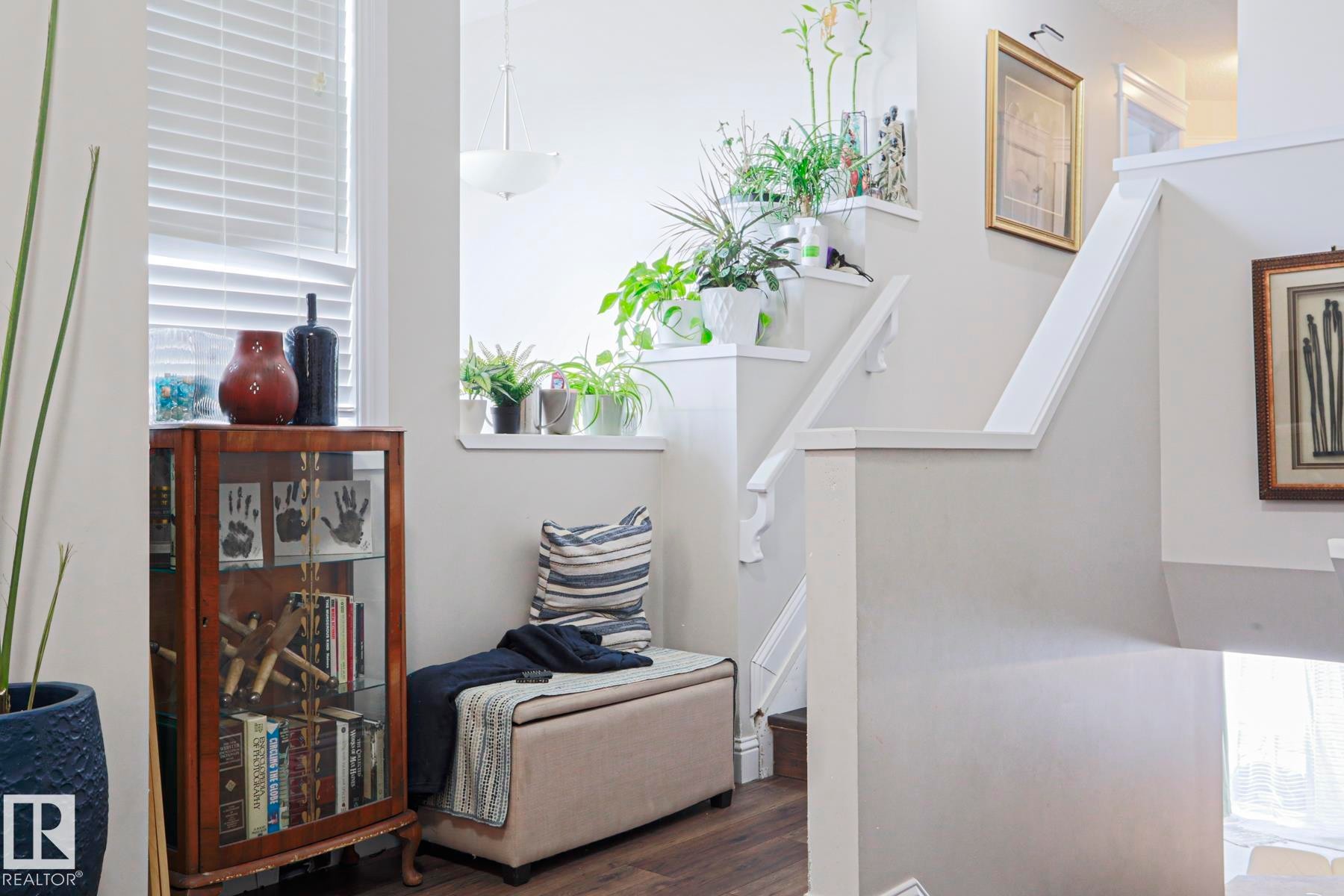Interior stairway with white painted risers and handrails - 1621 64 Street, Edmonton, AB - Indoor Photo Showing Other Room